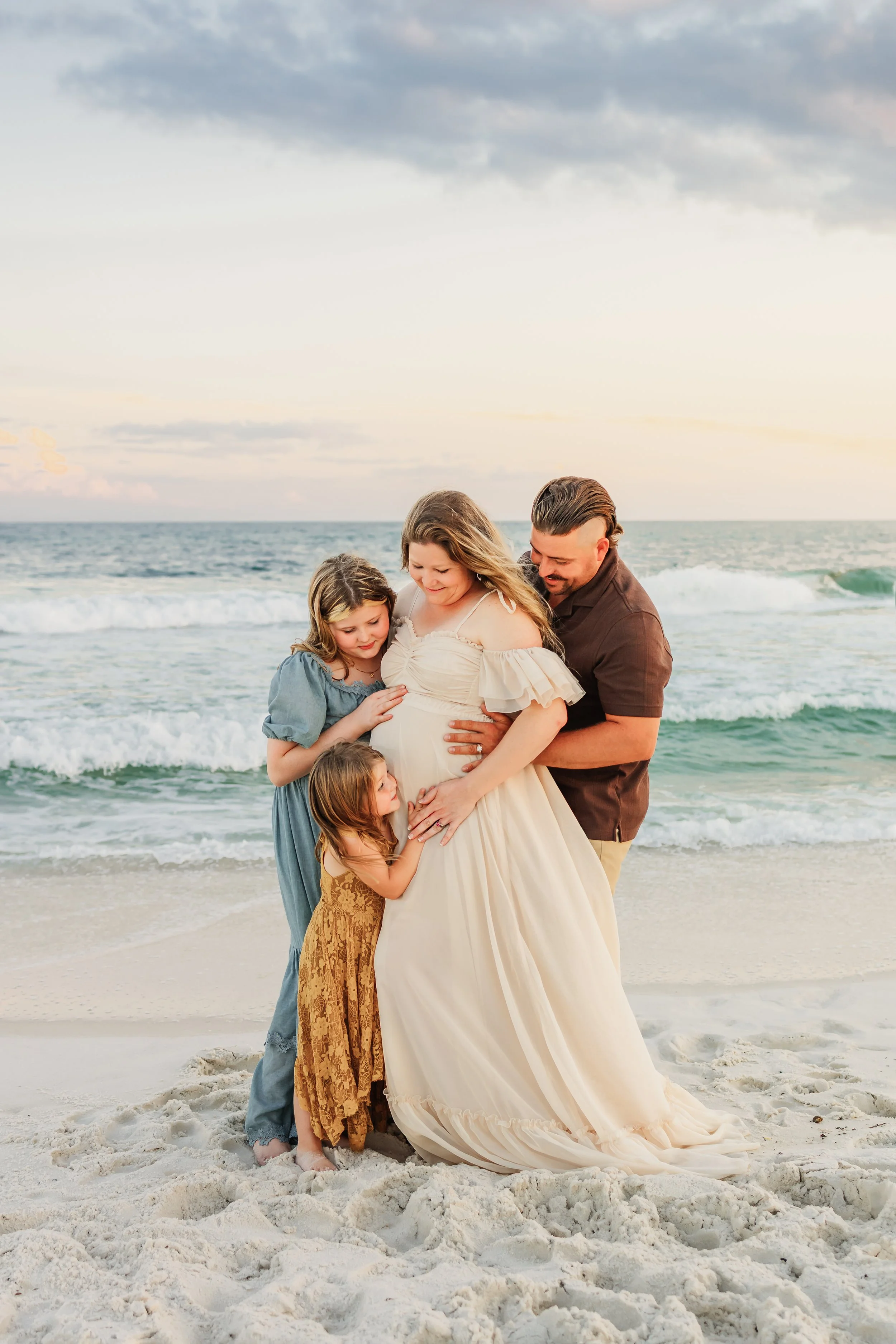 Young family having a photo session with a Pensacola Beach Photographer and Navarre Beach Photographer in Pensacola, FL