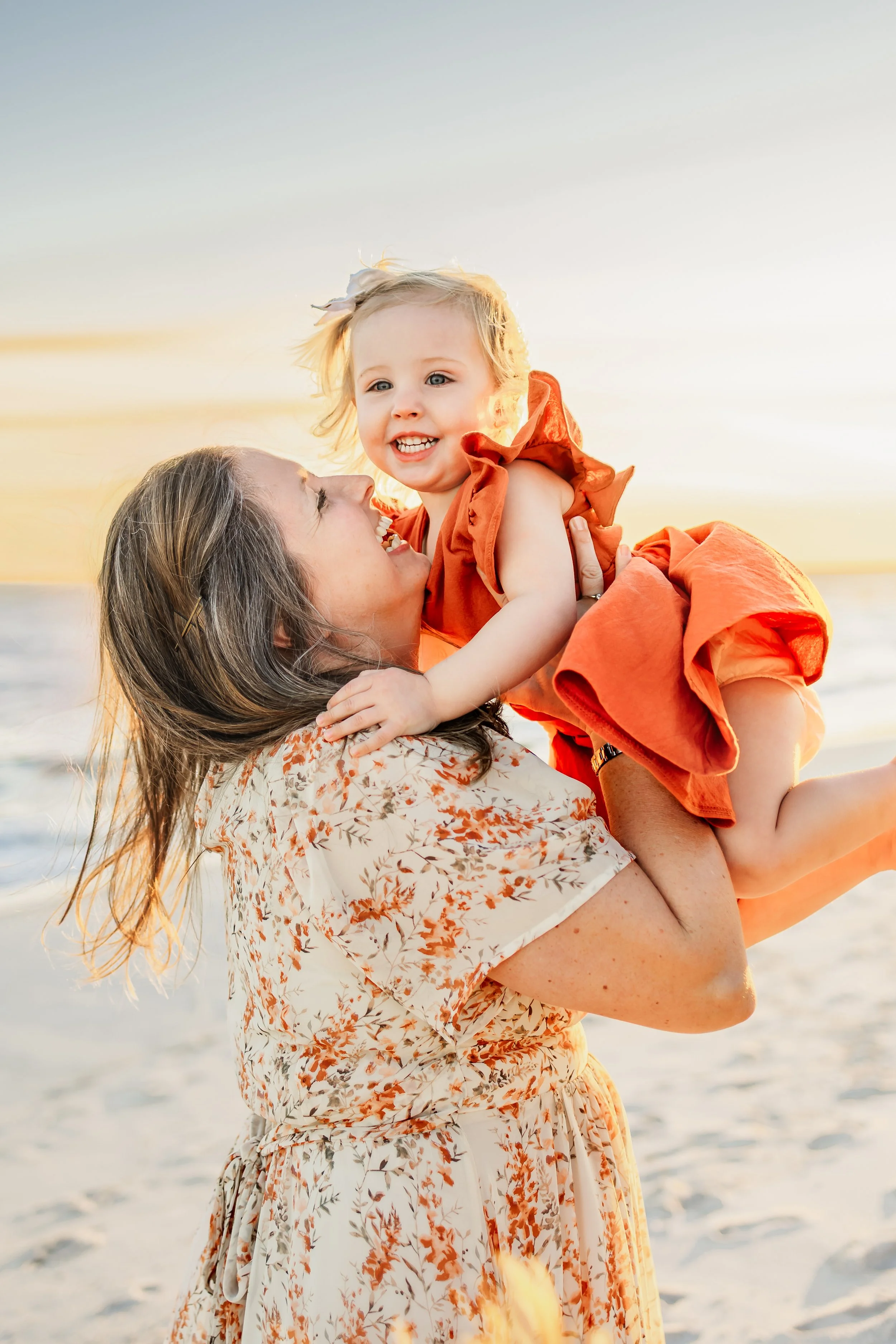 Young family having a photo session with a Pensacola Beach Photographer and Navarre Beach Photographer in Pensacola, FL