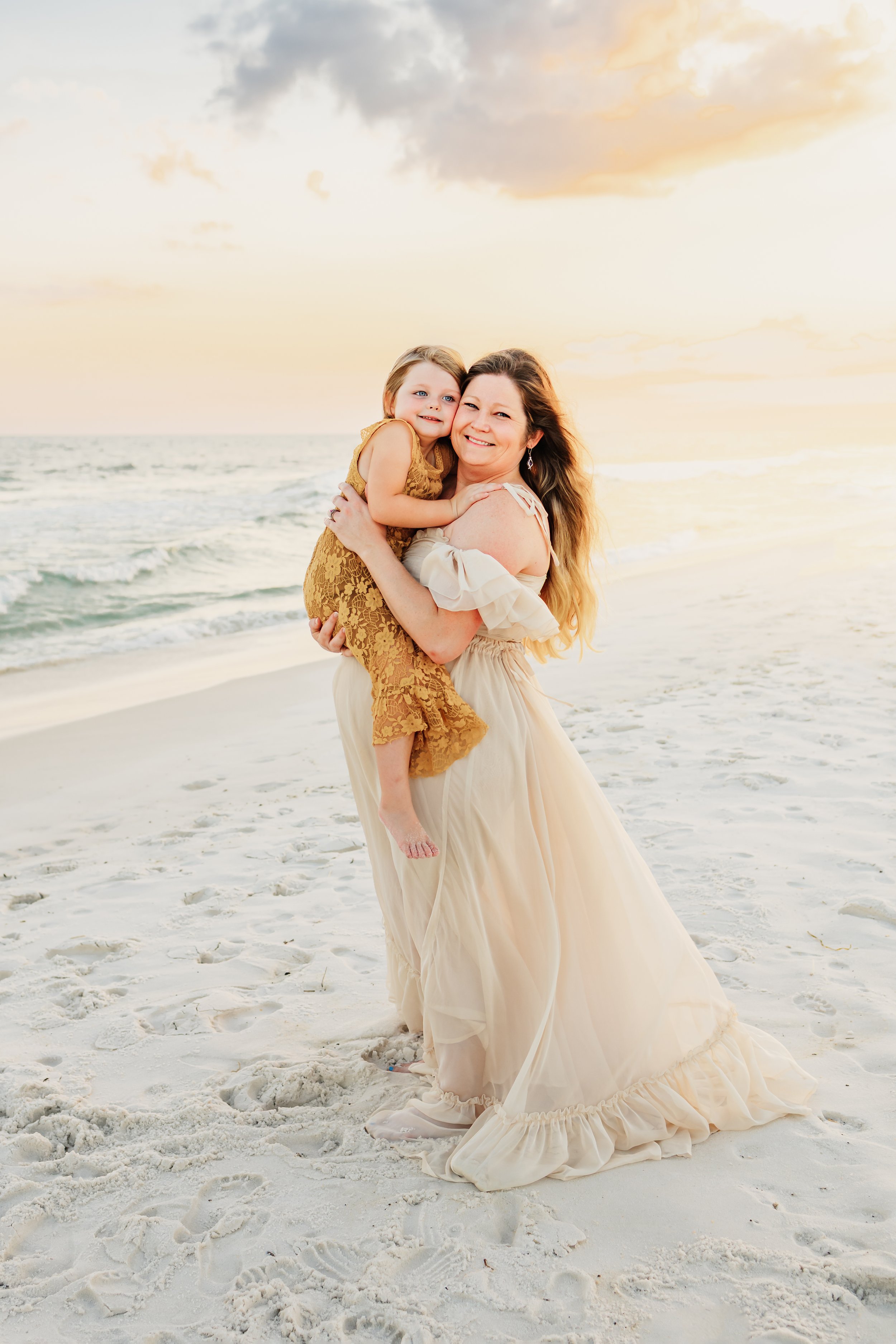 Young family having a photo session with a Pensacola Beach Photographer and Navarre Beach Photographer in Pensacola, FL