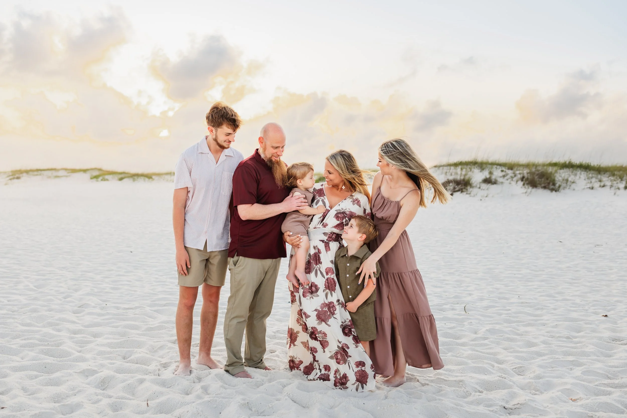 Young family having a photo session with a Pensacola Beach Photographer and Navarre Beach Photographer in Pensacola, FL