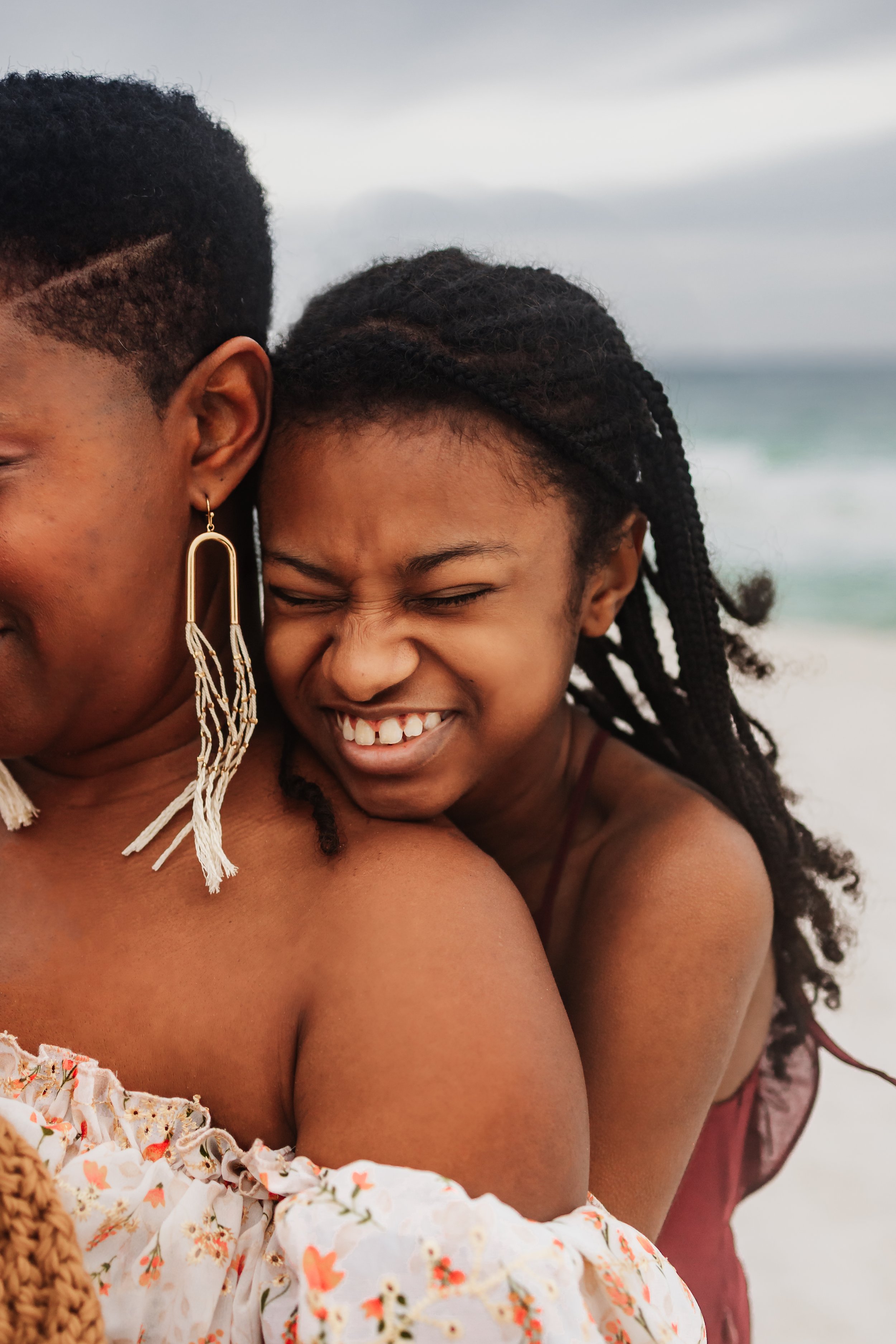 Young family having a photo session with a Pensacola Beach Photographer and Navarre Beach Photographer in Pensacola, FL