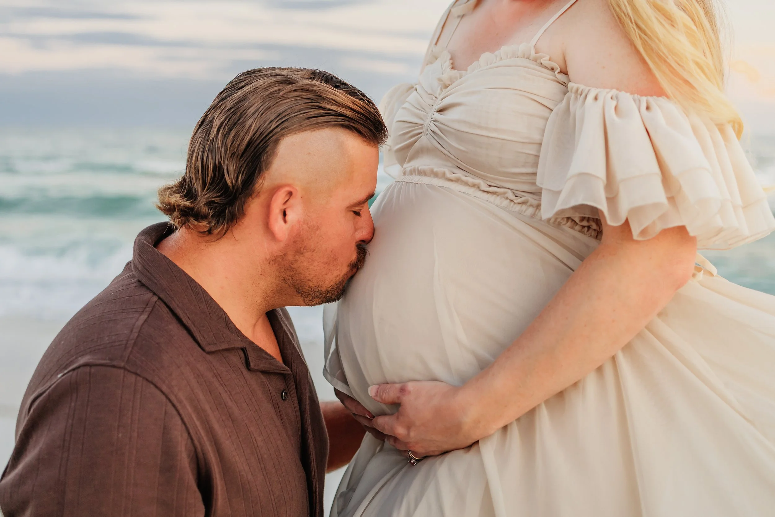 Young family having a photo session with a Pensacola Beach Photographer and Navarre Beach Photographer in Pensacola, FL