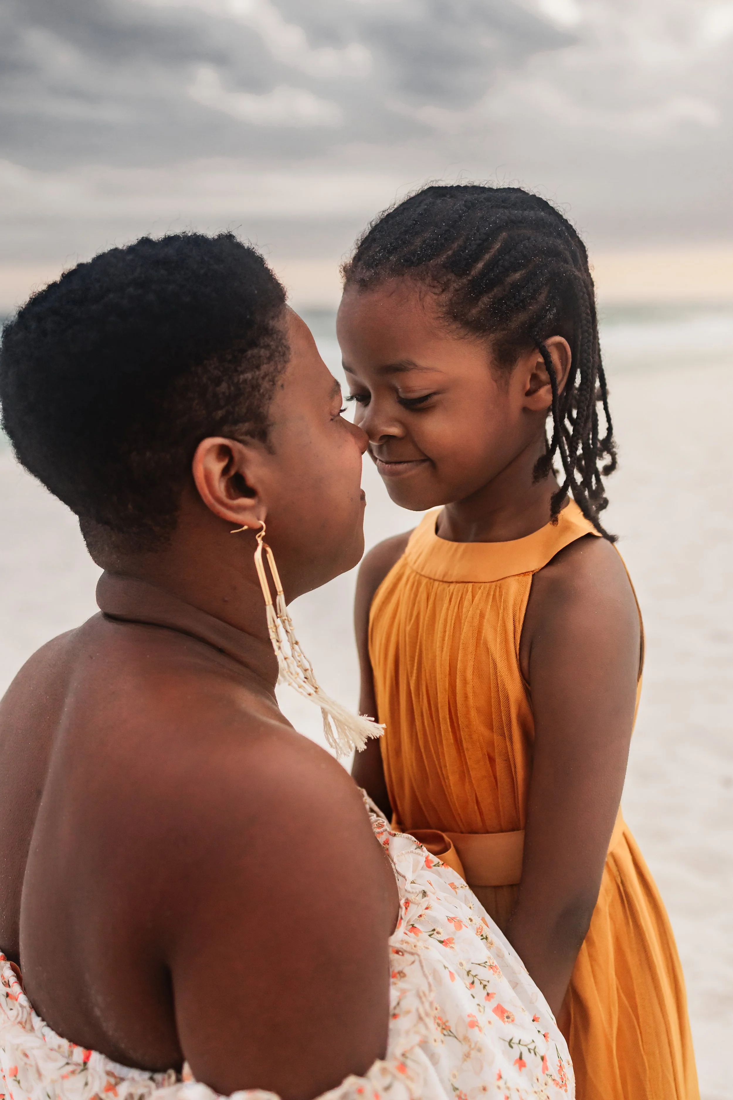 Young family having a photo session with a Pensacola Beach Photographer and Navarre Beach Photographer in Pensacola, FL