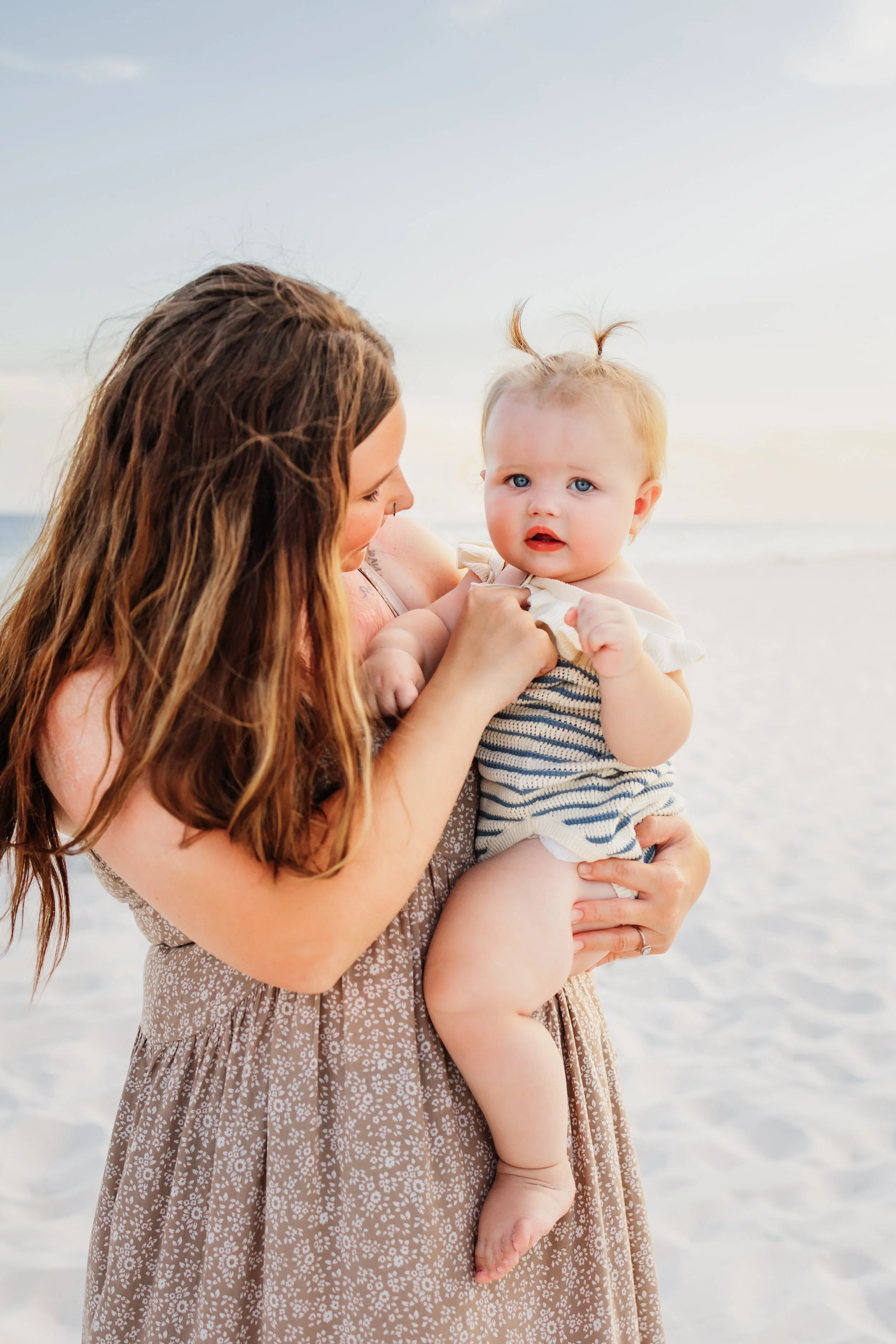 Young family having a photo session with a Pensacola Beach Photographer and Navarre Beach Photographer in Pensacola, FL