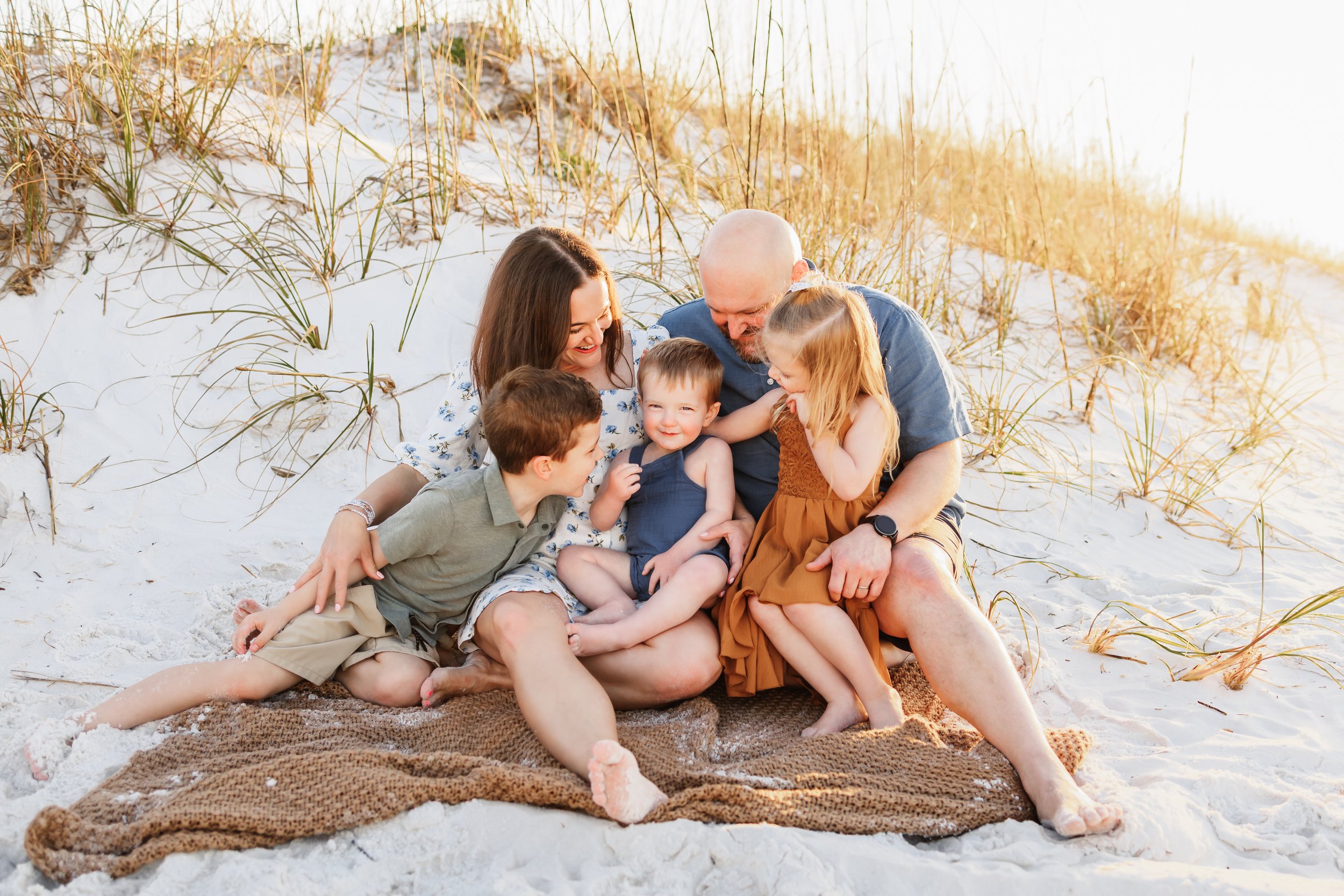 Young family having a photo session with a Pensacola Beach Photographer and Navarre Beach Photographer in Pensacola, FL