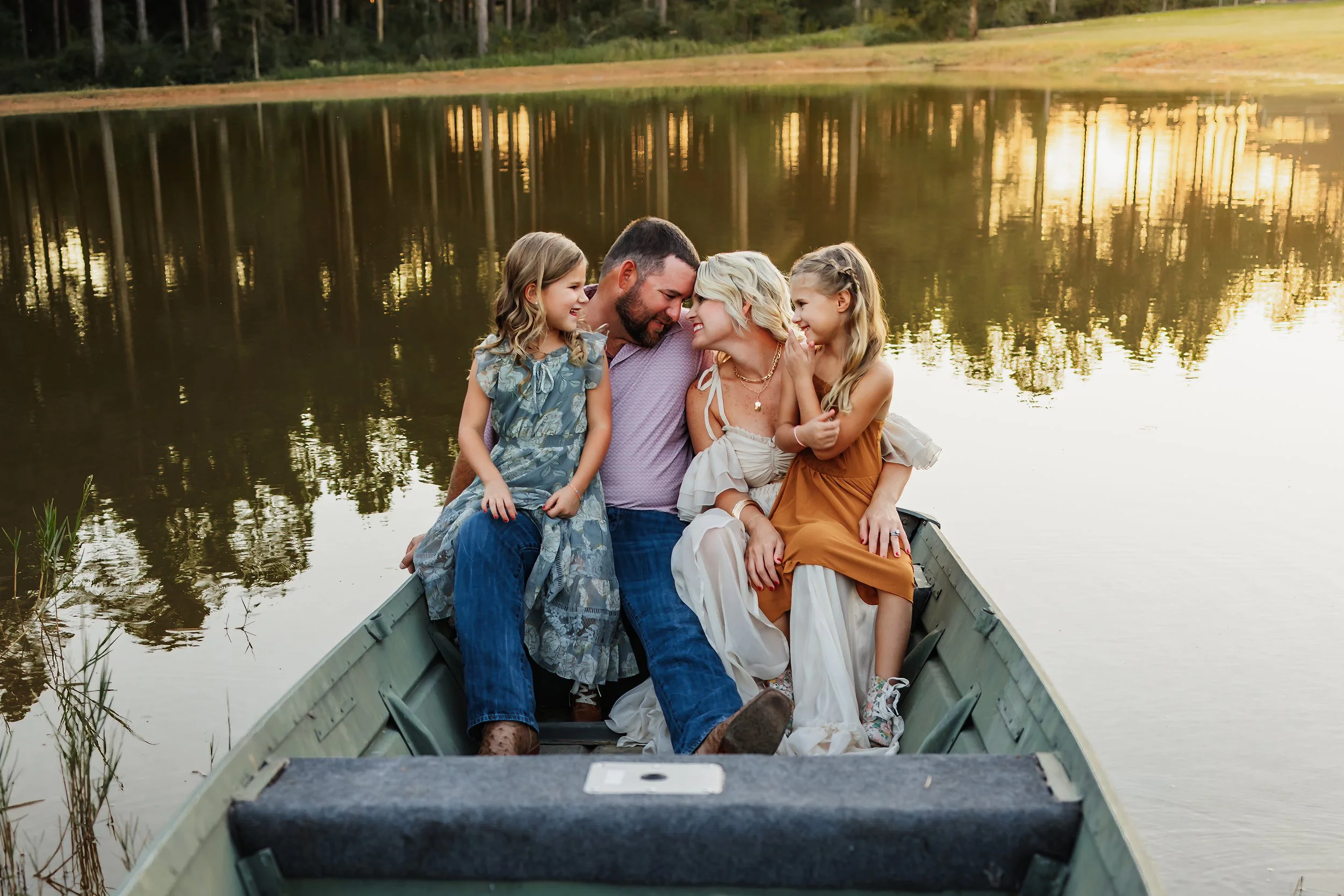 Young family having a photo session with a Pensacola Beach Photographer and Navarre Beach Photographer in Pensacola, FL