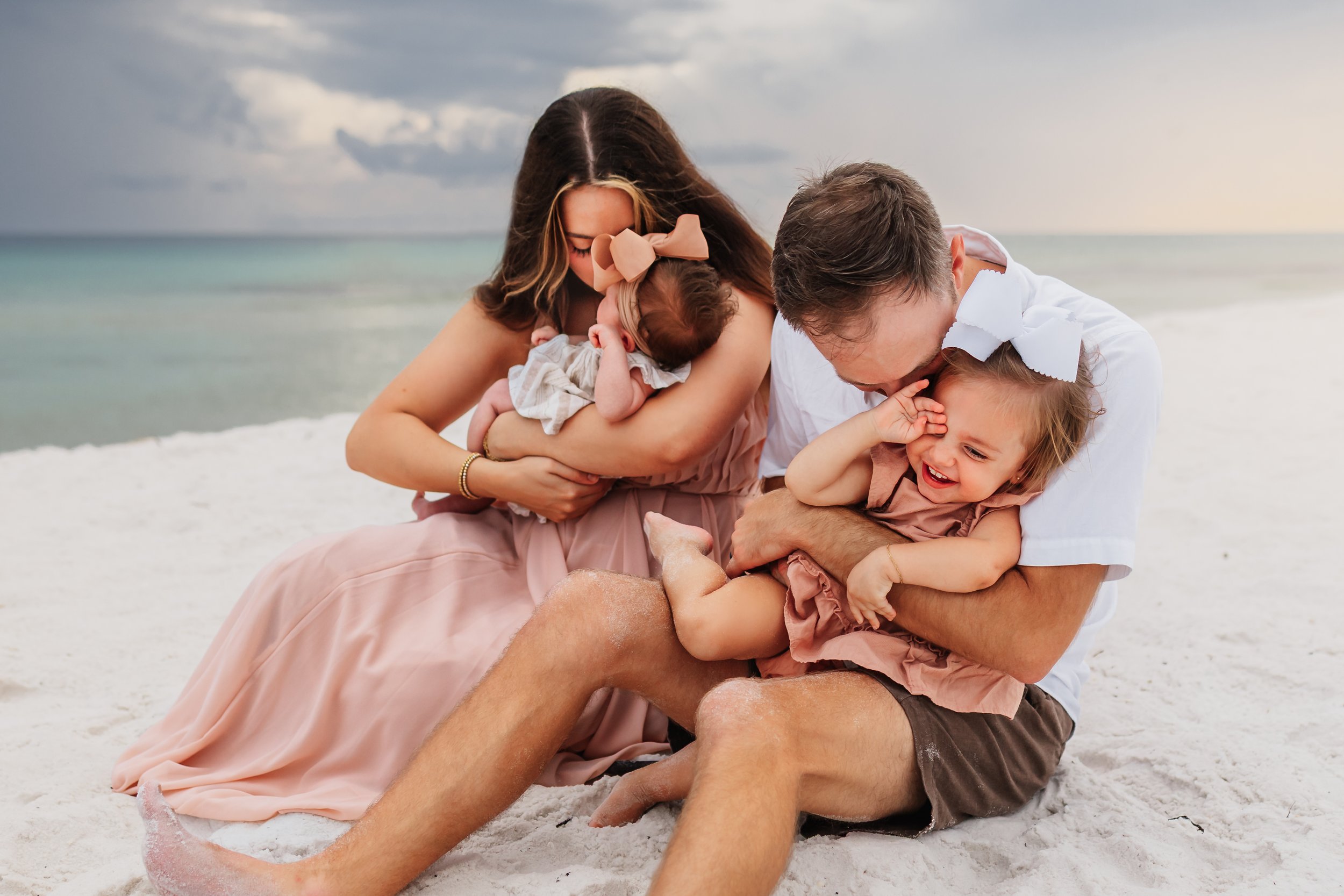 Young family having a photo session with a Pensacola Beach Photographer and Navarre Beach Photographer in Pensacola, FL