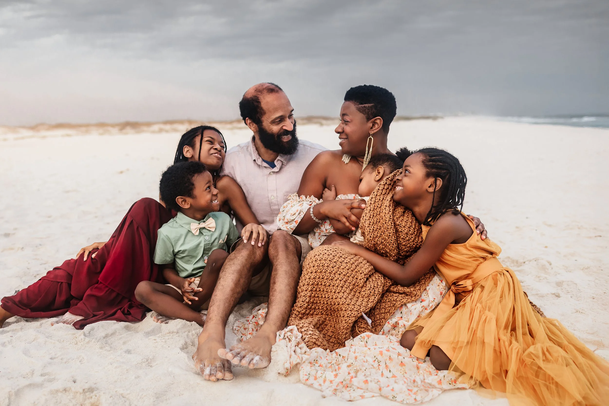 Young family having a photo session with a Pensacola Beach Photographer and Navarre Beach Photographer in Pensacola, FL