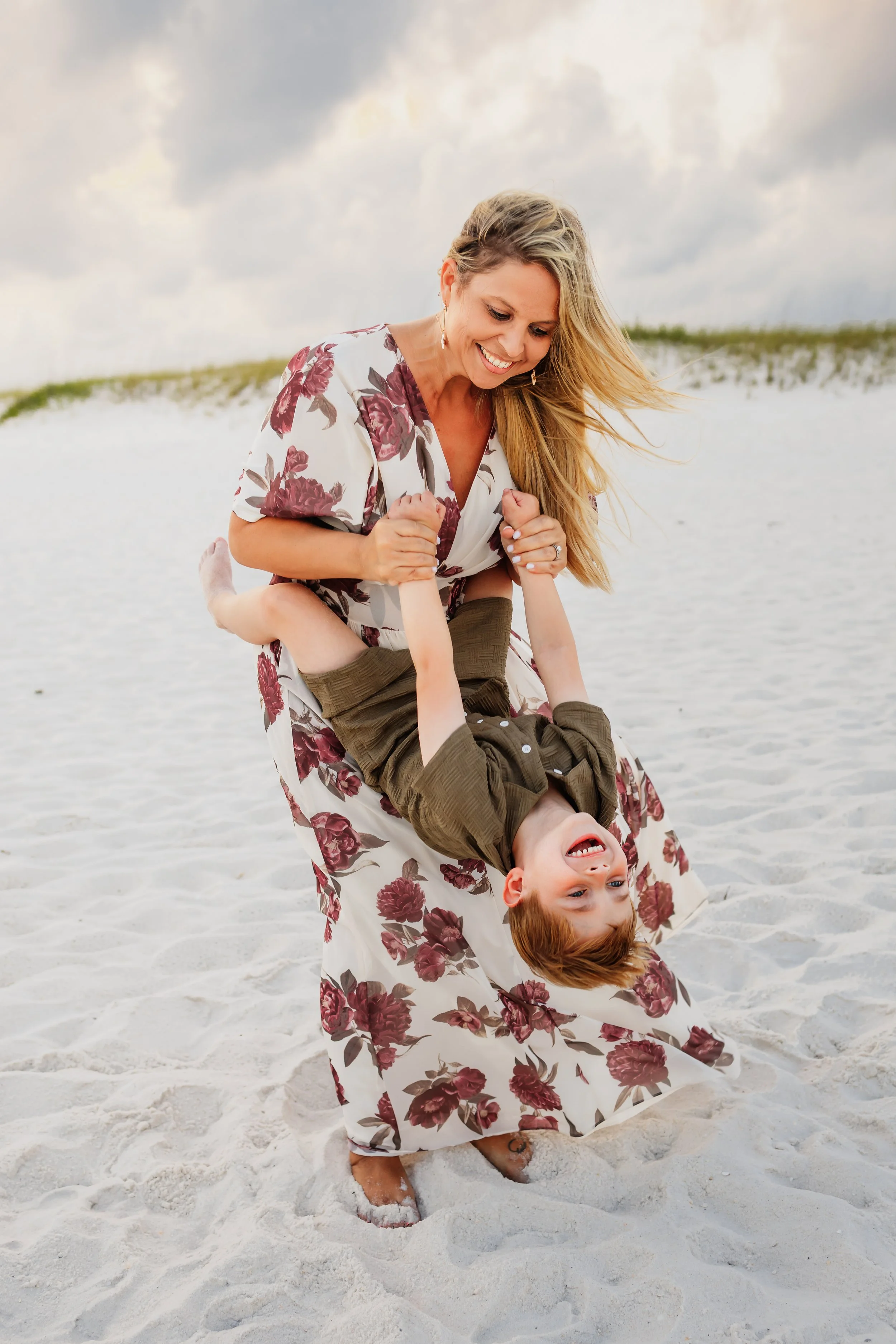 Young family having a photo session with a Pensacola Beach Photographer and Navarre Beach Photographer in Pensacola, FL