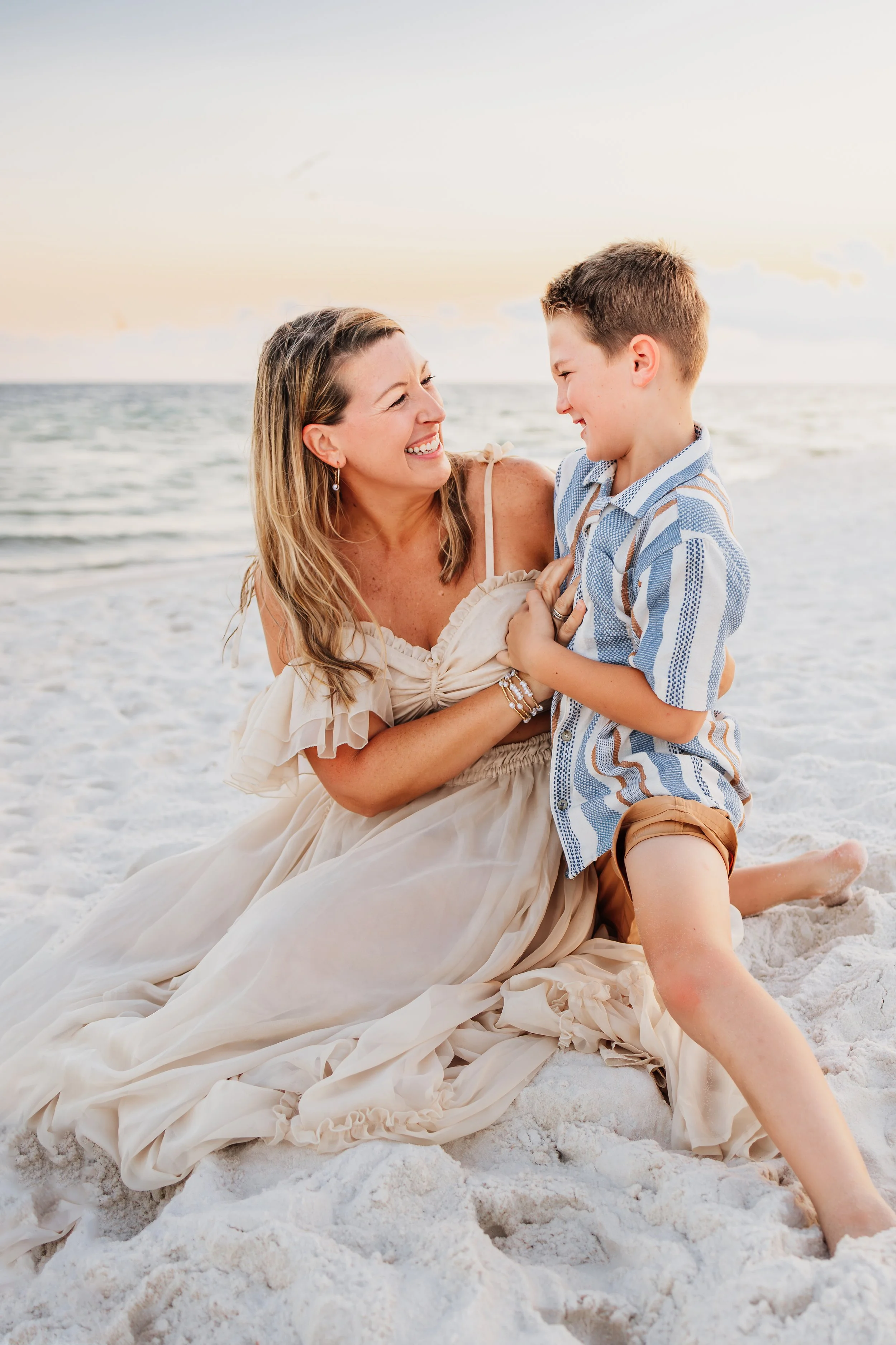 Young family having a photo session with a Pensacola Beach Photographer and Navarre Beach Photographer in Pensacola, FL