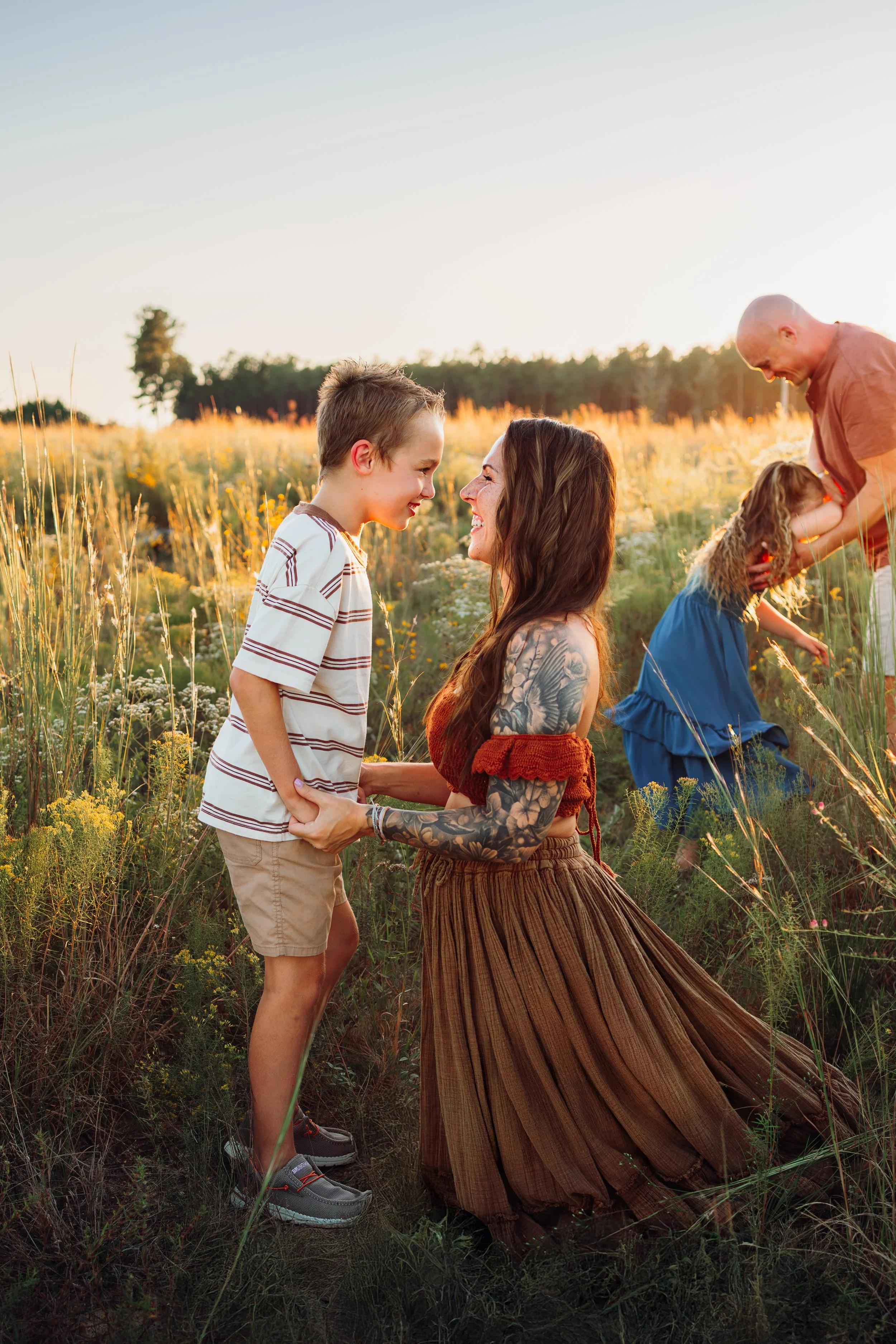 Young family having a photo session with a Pensacola Beach Photographer and Navarre Beach Photographer in Pensacola, FL