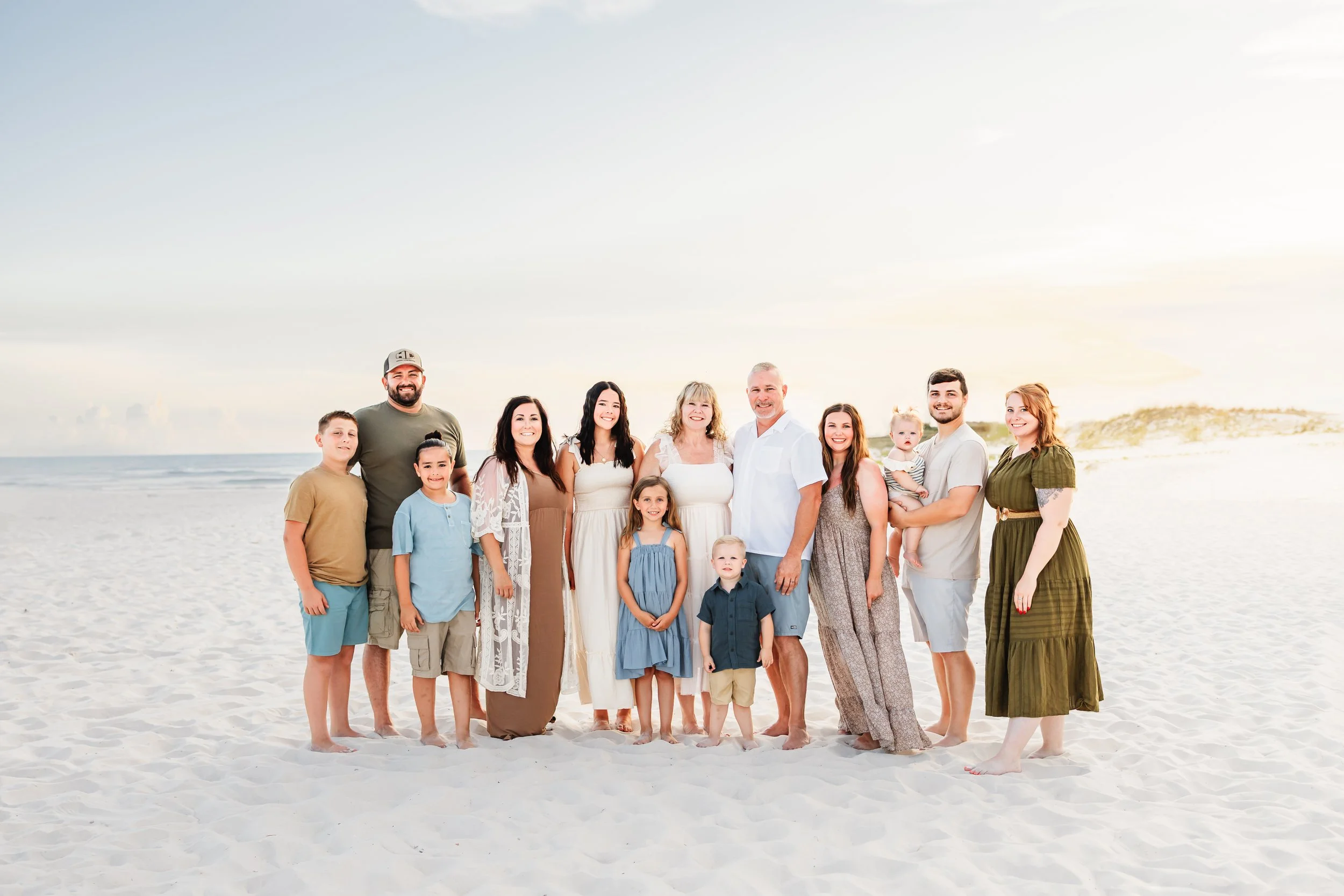 Young family having a photo session with a Pensacola Beach Photographer and Navarre Beach Photographer in Pensacola, FL