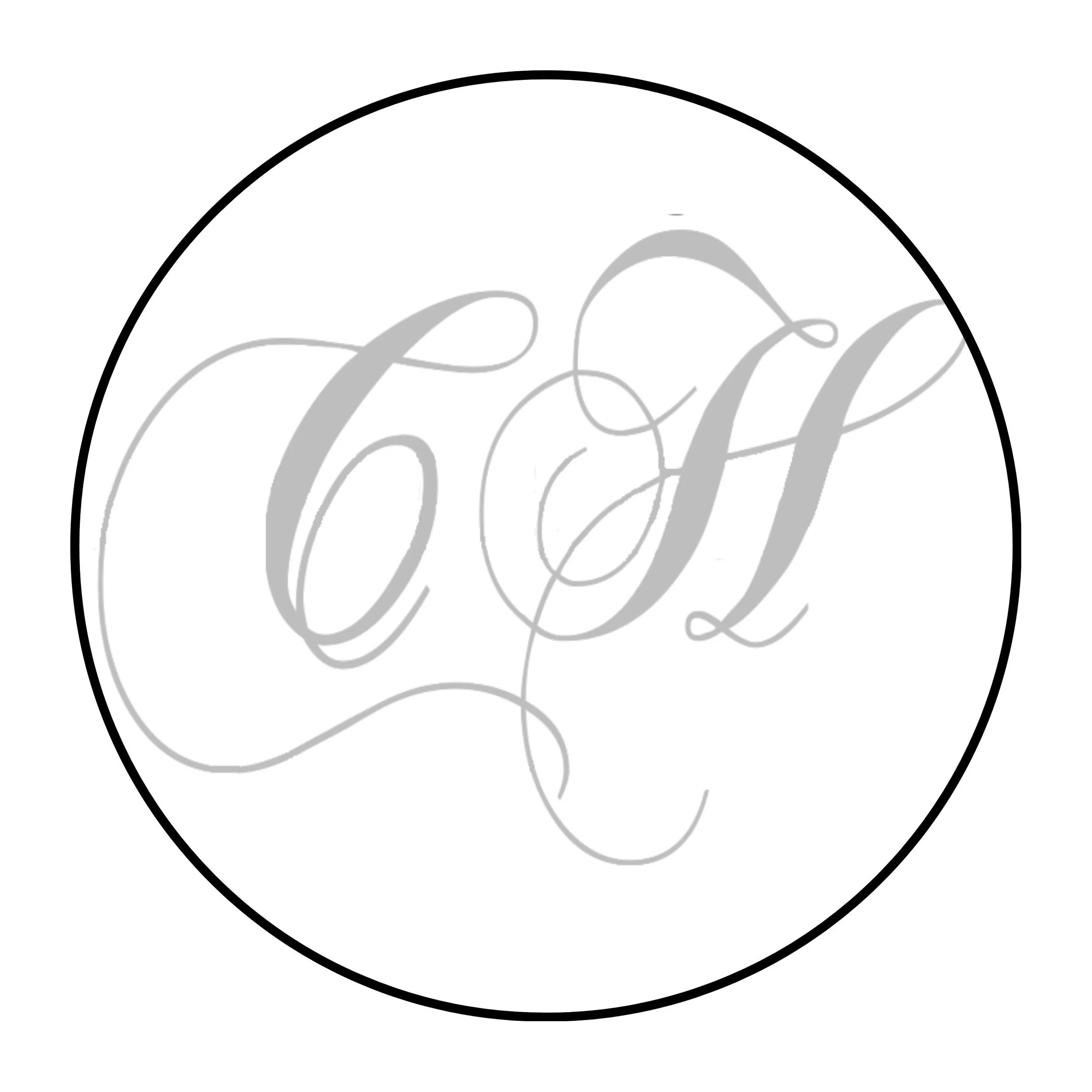A circular logo with a thin black border and grey cursive text inside.