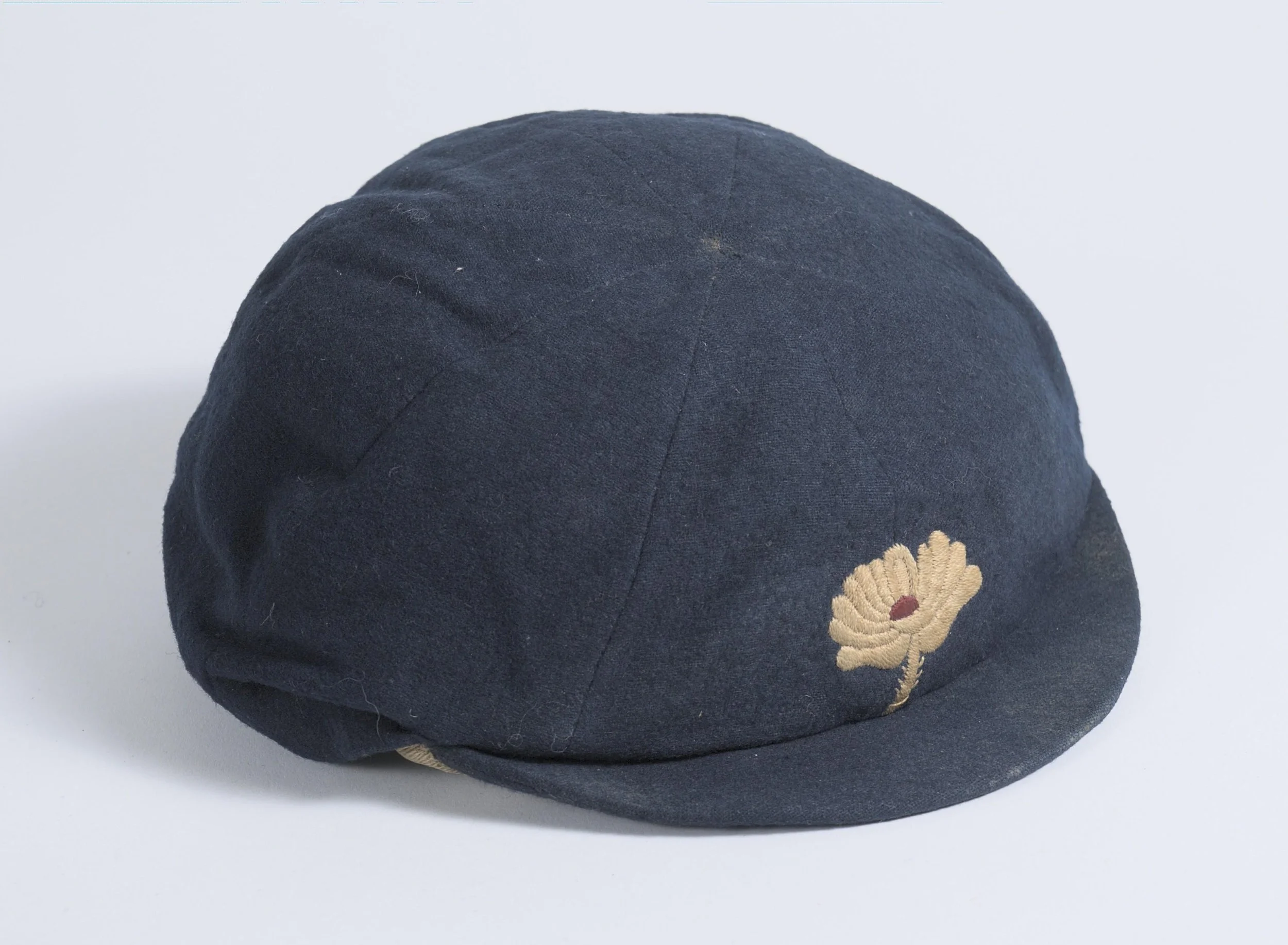 Lot 905
David Denton. Yorkshire & England 1894-1920. Early Yorkshire navy blue 1st XI cap, with the Yorkshire white rose emblem to the front worn by Denton during his playing career. The cap, with smaller peak, typical of a pre first world war cap,
