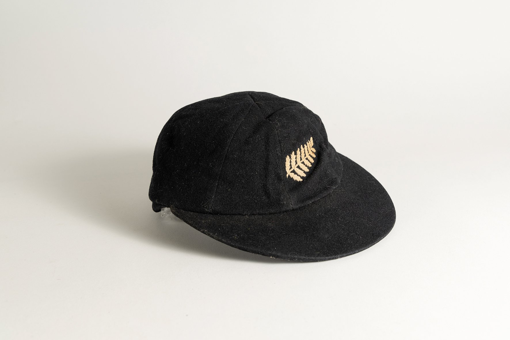 Lot 1066

Harry Butler Cave. Wellington, Central Districts and New Zealand 1945 to 1959. New Zealand black cloth Test cap, by Ballantyres of Timaru, Wellington, with embroidered 'silver fern' emblem of New Zealand to cap. Name to label 'H.B. Cave'. A