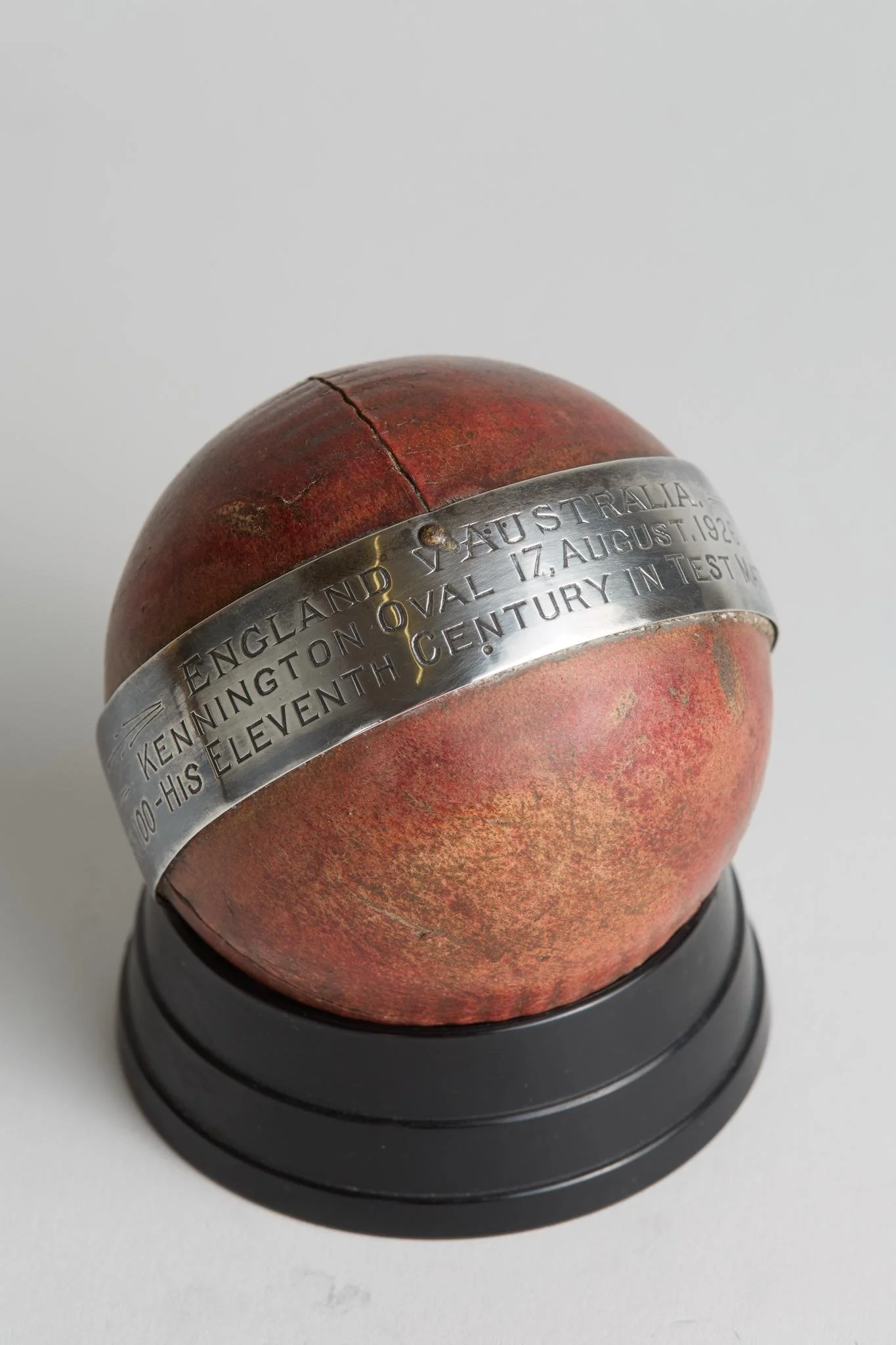 Lot 480
John Berry 'Jack' Hobbs. Surrey & England 1905-1934. 'England v Australia. Jack Hobbs 100 runs. Eleventh Test century 1926'. Cricket ball presented to Jack Hobbs with silver band around the ball with the inscription 'England v Australia. Ken
