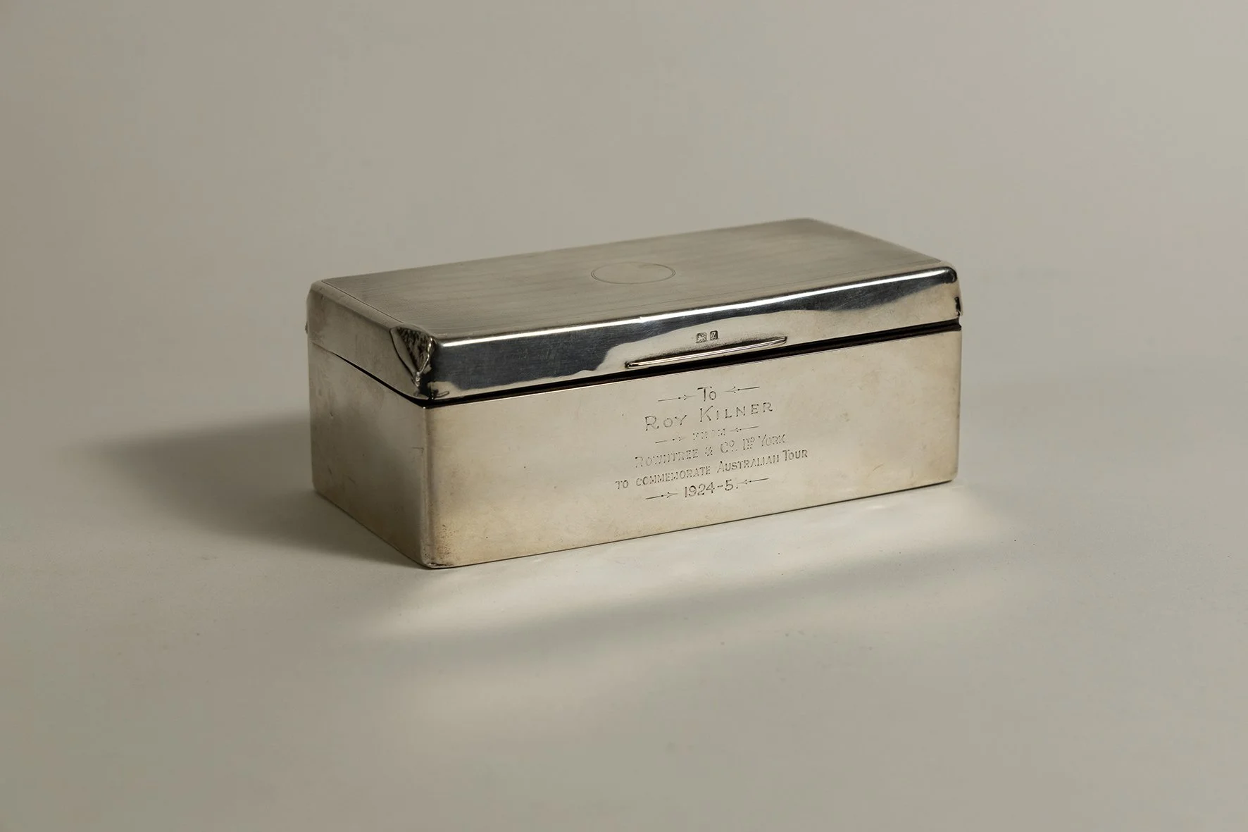 Lot 1052

Roy Kilner. Yorkshire, Europeans & England 1911-1927. Impressive hallmarked silver cigarette box with machine tooled decoration to the box lid. Inscription to front 'To Roy Kilner from Rowntree & Co Ltd, York to commemorate Australia Tour 1