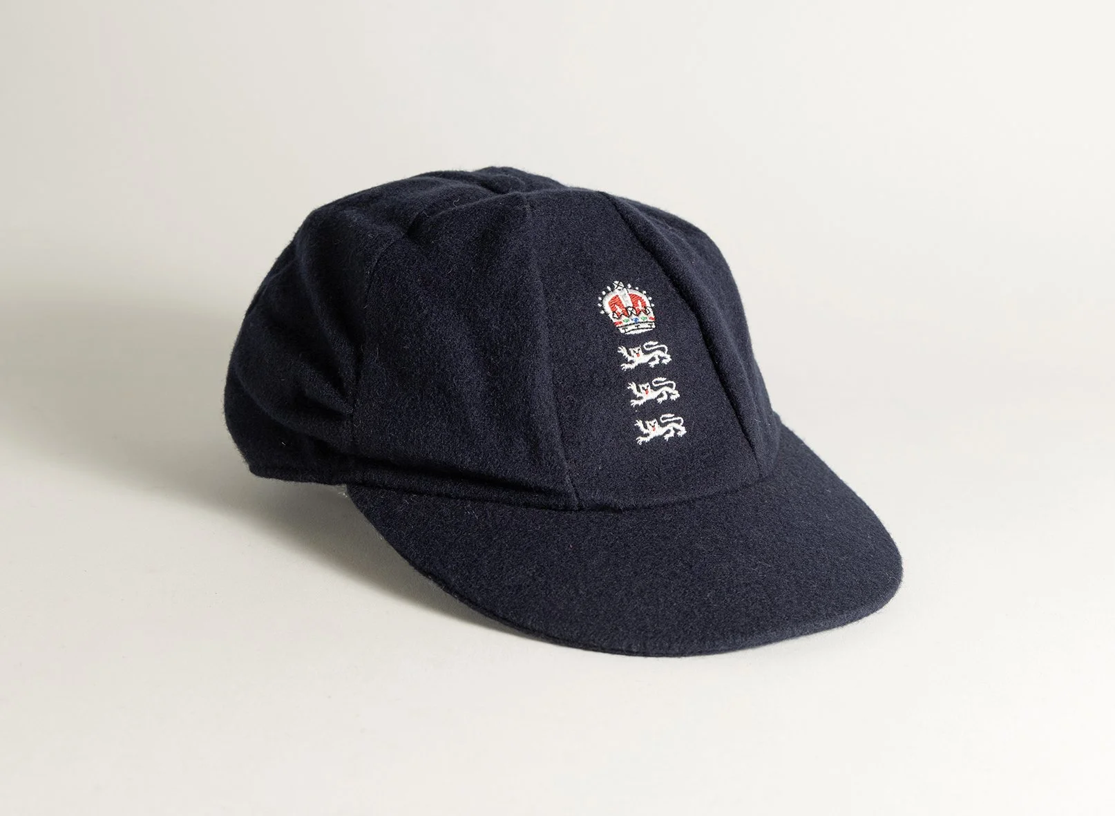 Lot 1058
Andrew Richard Caddick. Somerset & England 1991-2009. England navy blue cloth Test cap, by Albion C&D of Australia, with embroidered three lions and coronet emblem of England to cap, worn by Caddick in the England v Australia 'Ashes' series 