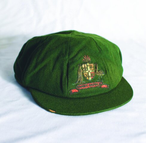 Lot 407 –
Clarence Victor 'Clarrie' Grimmett. Wellington, Victoria, South Australia & Australia 1911-1941. Australian green wool Test cap with Australian emblem to front with kangaroo and emu embroidered in metal thread and coloured thread with the