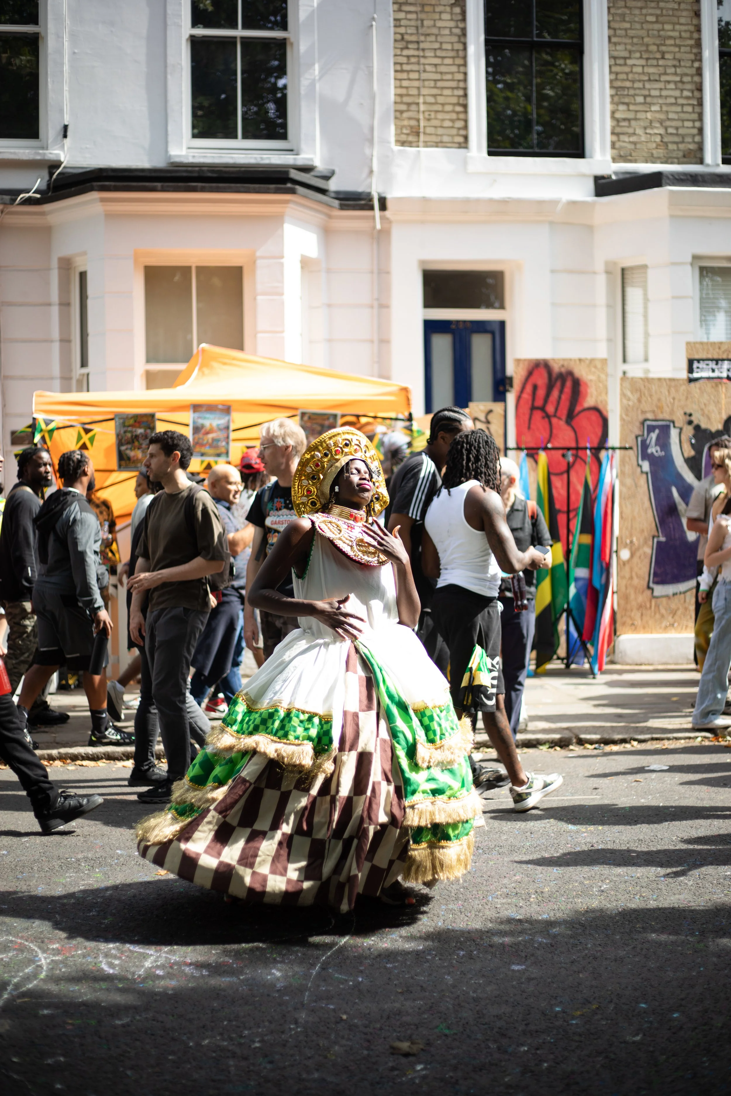 A performer dances in Notting Hill Carnival in London