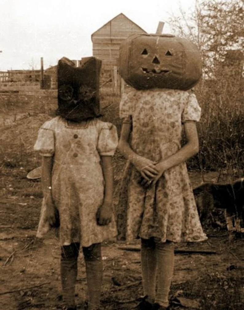Read the full title Vintage Halloween Kids Pumpkin Head Vintage Photo Spooky Creepy Halloween Mask Occult Black and White Halloween Photo Freaky Print X62.png