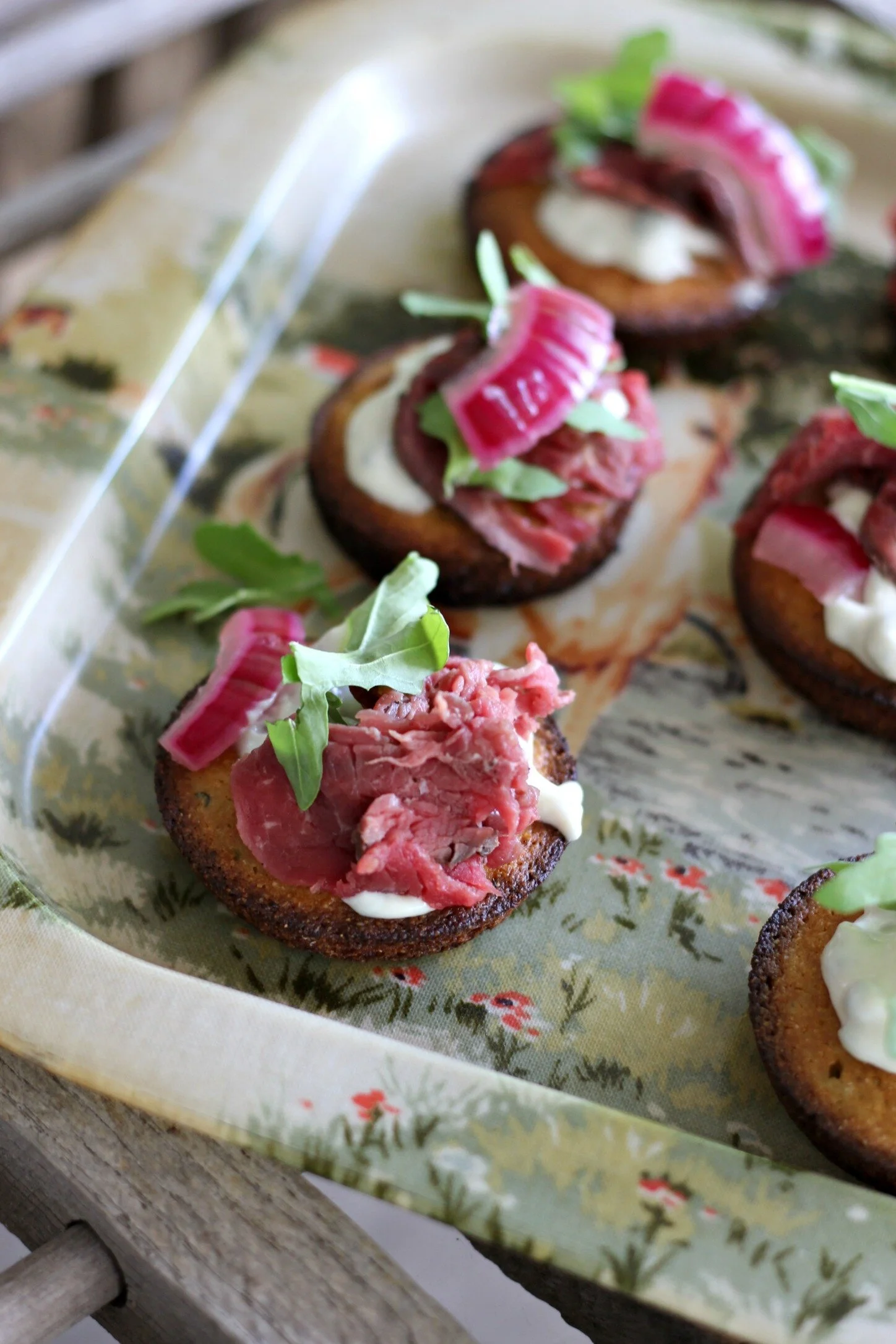 Beef Tenderloin Cornbread Crostini with Horseradish Blue Cheese Sauce