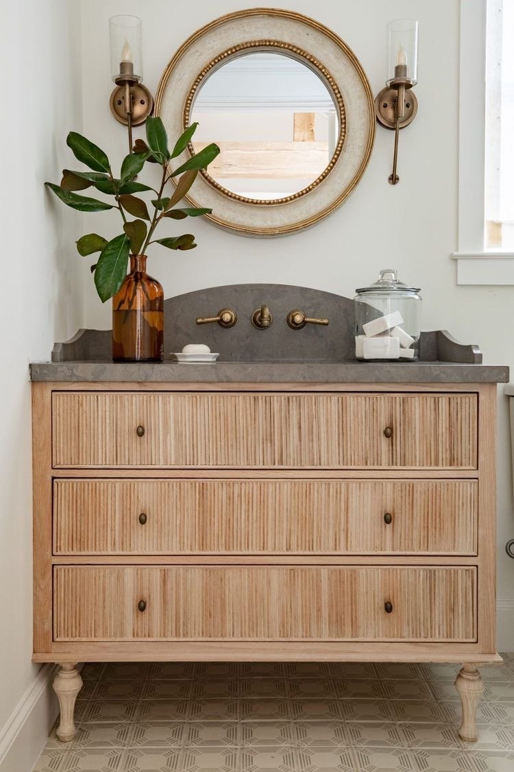  I really love the backsplash and countertop design on this vanity! I also love the reed detail on the front of vanity drawers and thought that could be something easy to DIY to add personality to our current vanity. 