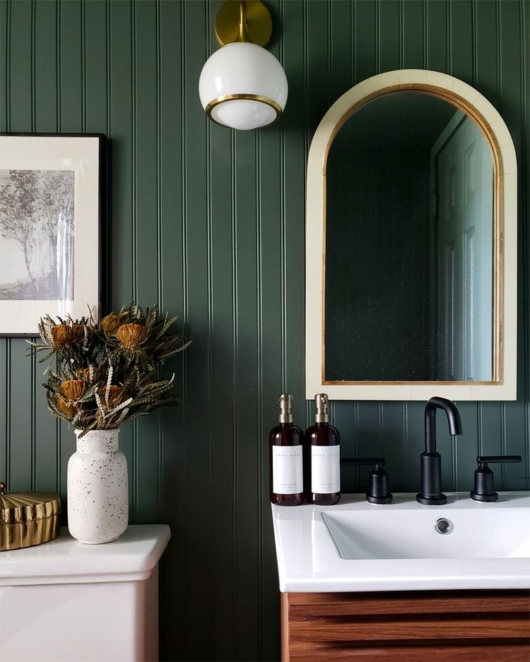  Love the wall trim, paint color, mirror, and lighting in here! 