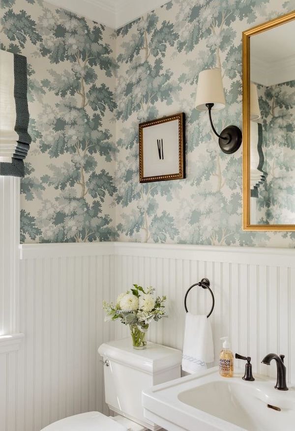  I love the mix of metals, wallpaper, and traditional feel of this space. 