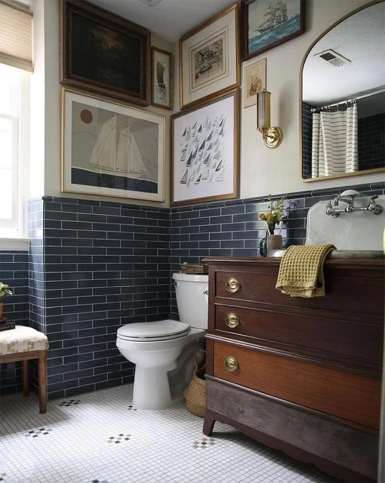 I love the mix of old and new in here. I would love to add more vintage artwork and update the lighting and mirror similar to this! 