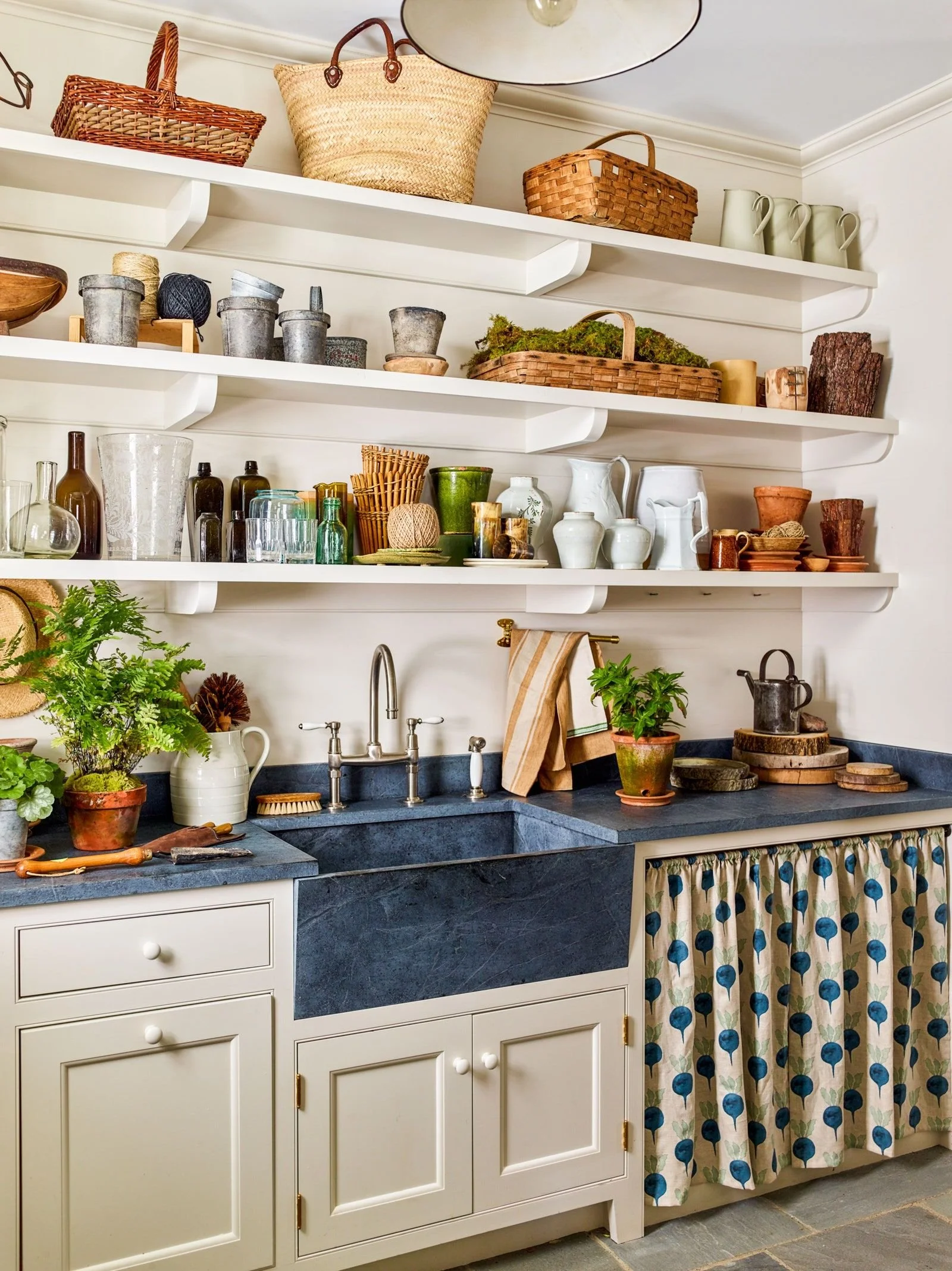 I love this cabinet layout with open shelving above and lower cabinets with some skirted detail.