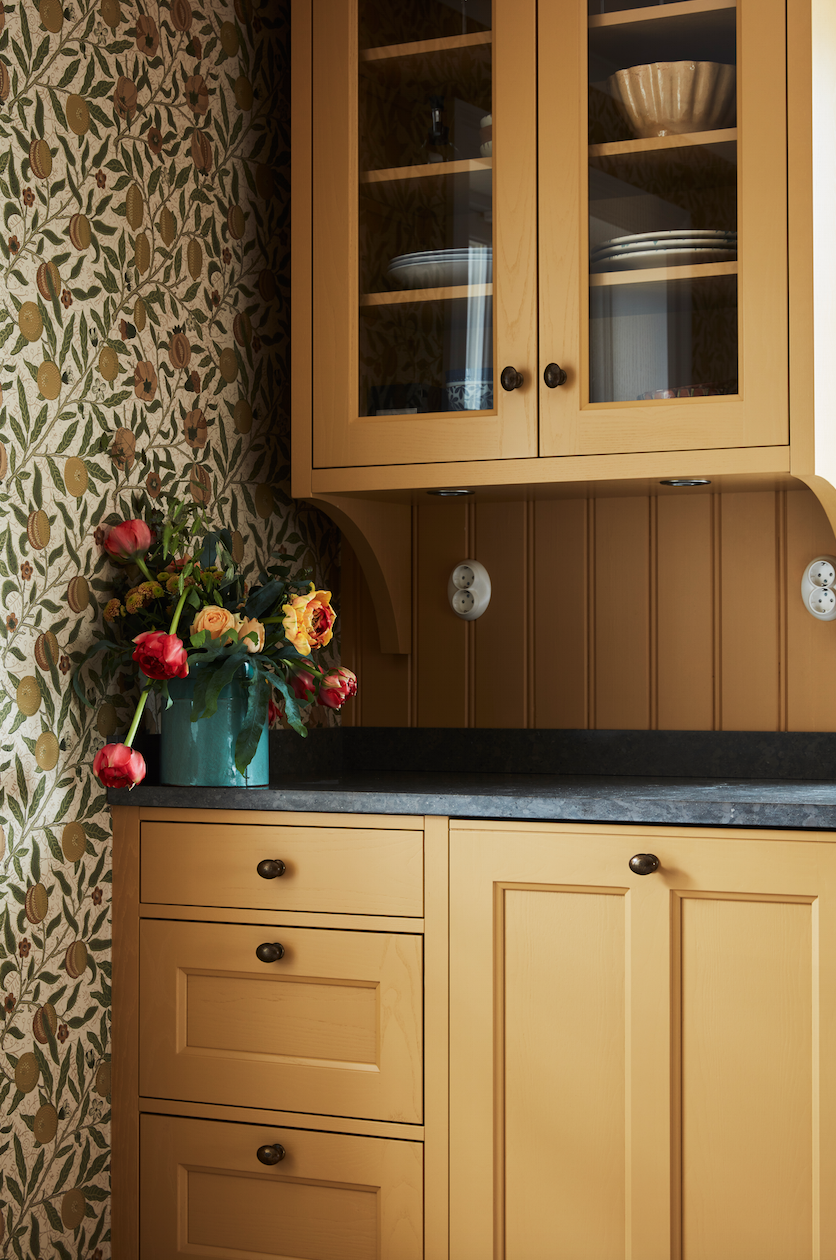 More yellow cabinets! So dreamy!  The wallpaper pulls it toward the cottage vibe.