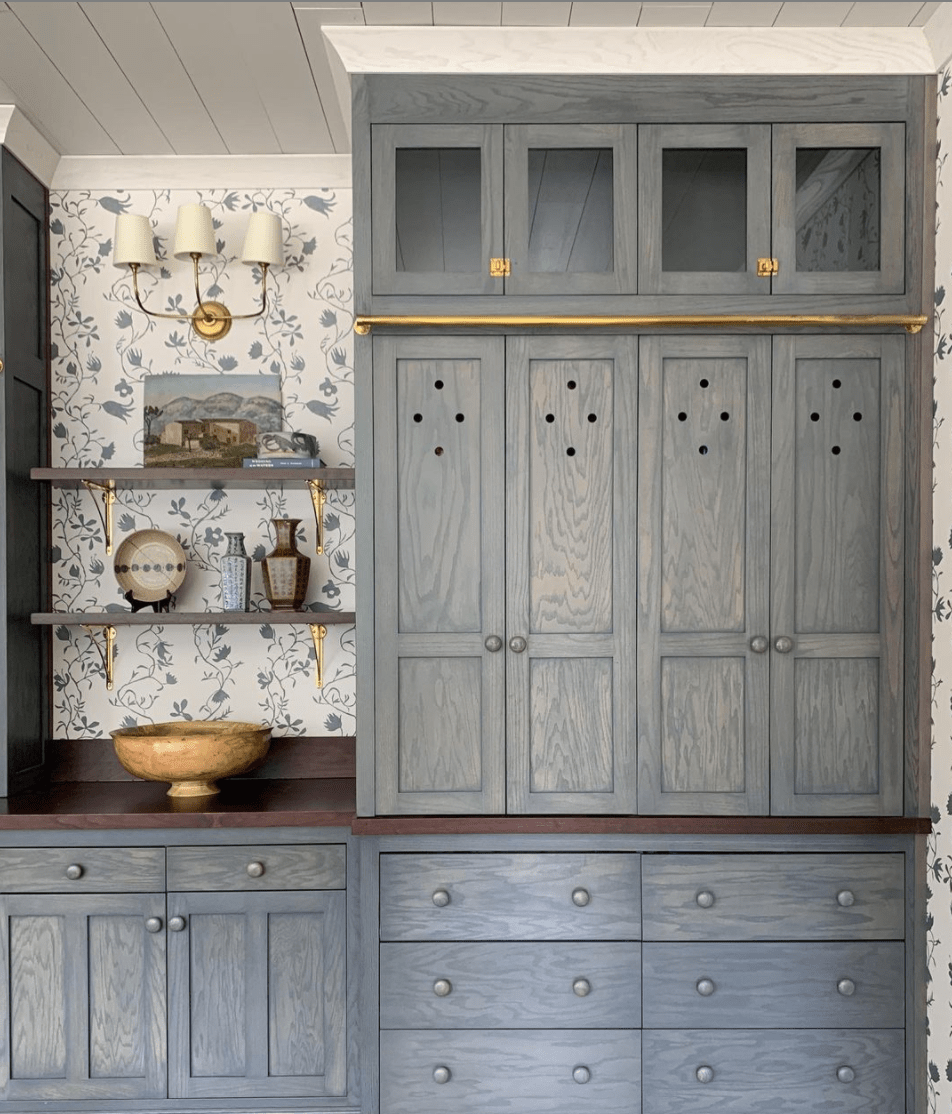 The most perfect wallpaper and cabinet color combo- also love how they made that little open shelf nook!