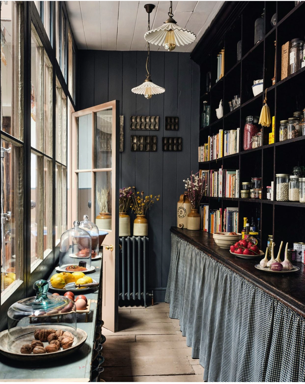 Another great skirted cabinet example with open shelving above!