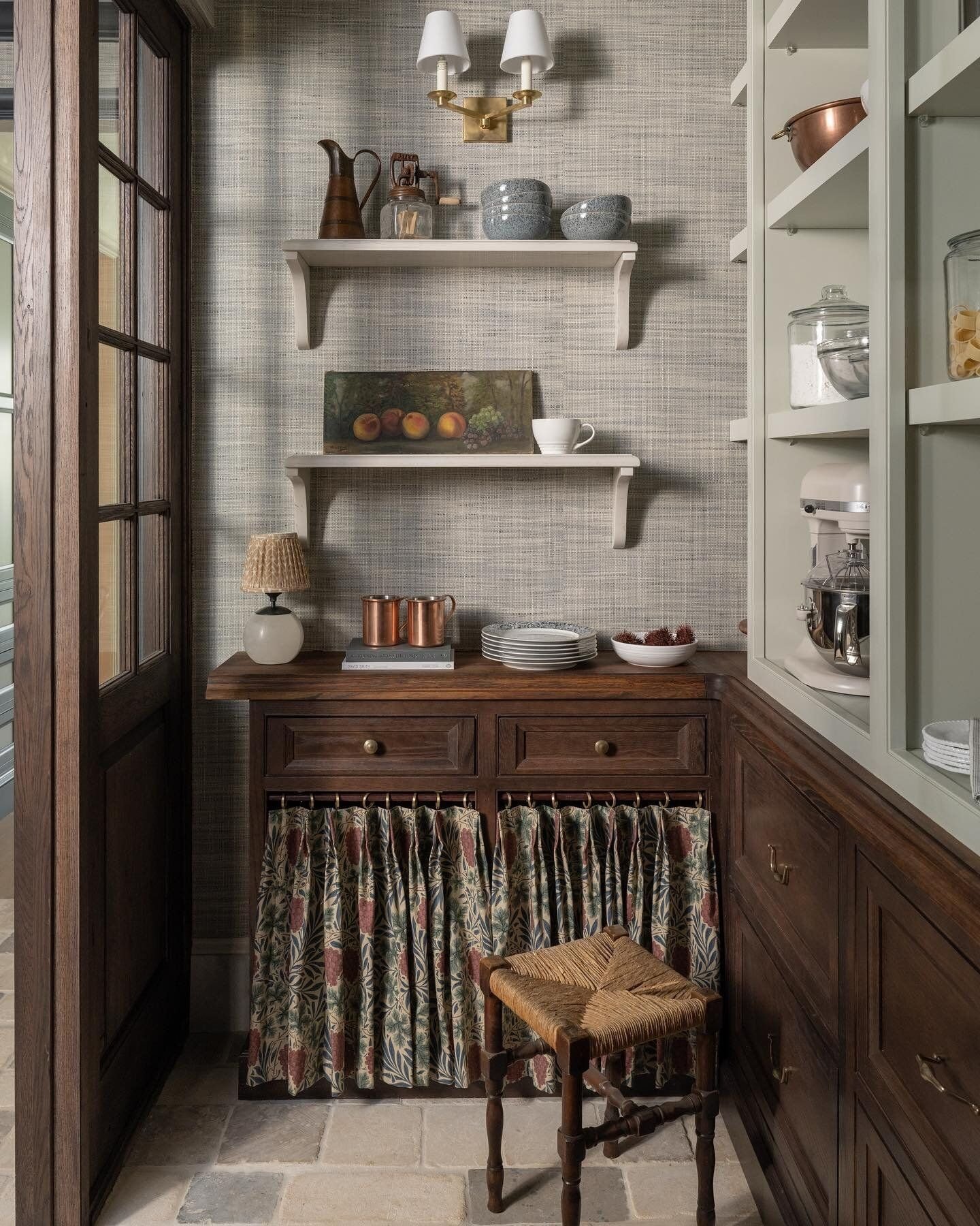 This pantry space has it all and is one of my main inspirations- the wallpaper, skirted cabinet, + open shelving!