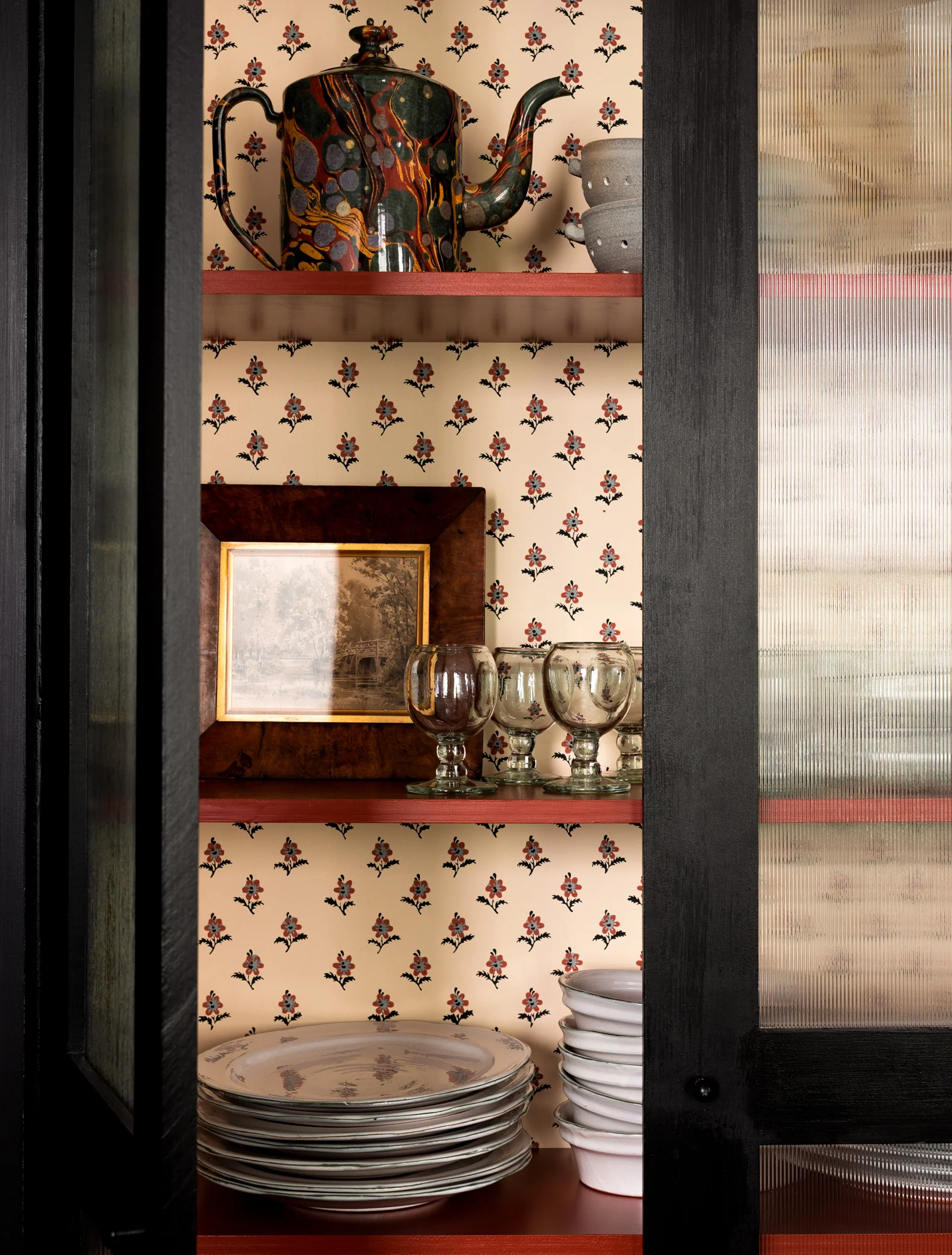 Love the wallpaper detail inside the cabinets!