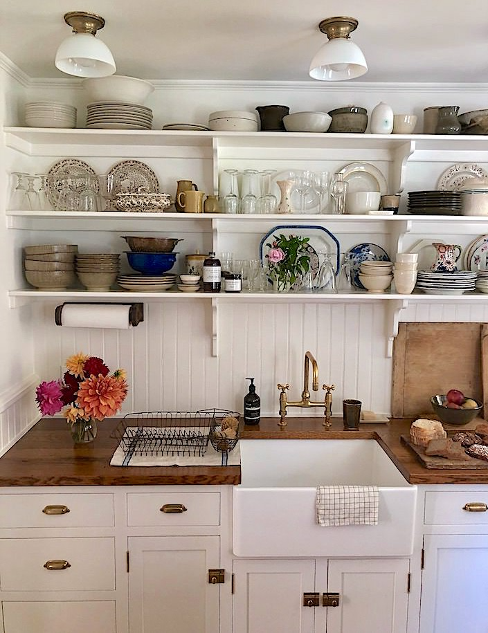 Love this simple cottage feel and cabinet layout!