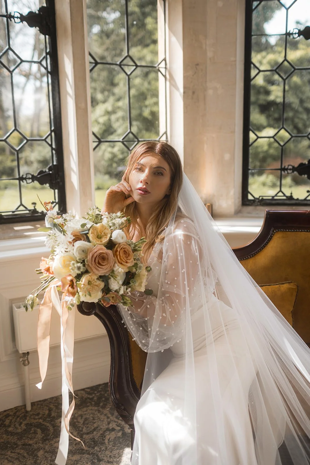 Bride with elegant wedding dress and long veil
