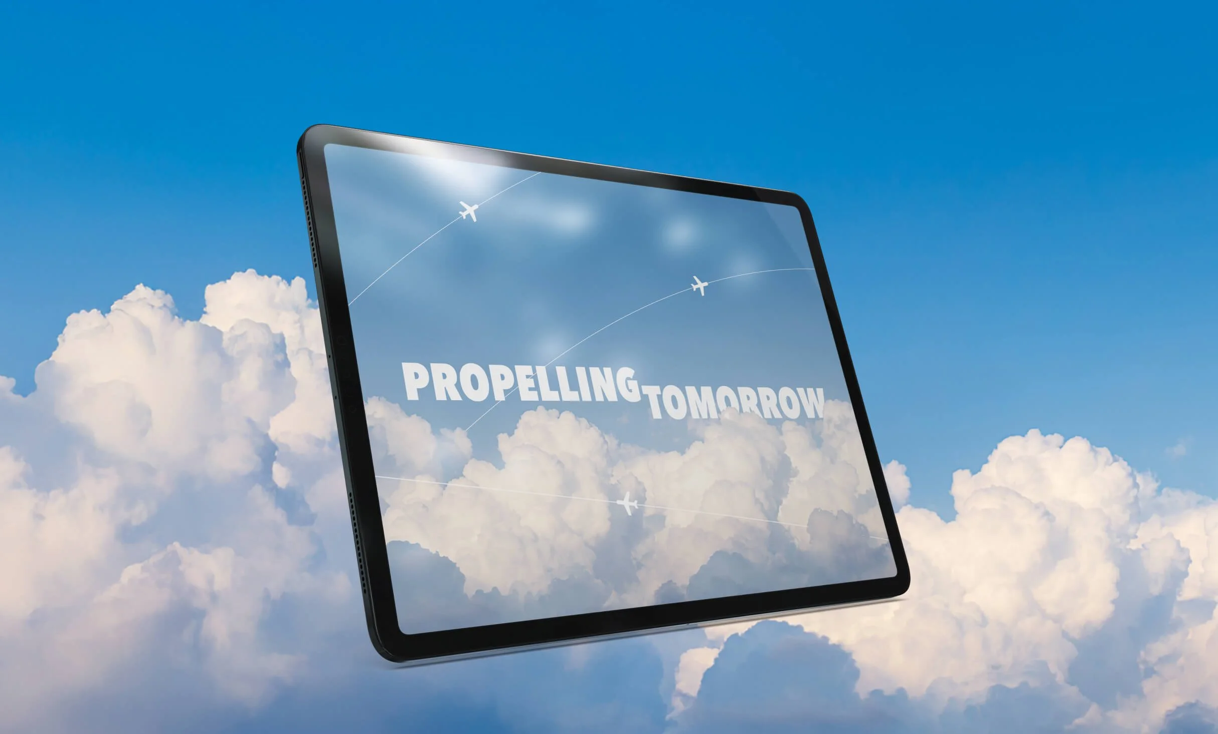 A tablet shows the title 'Propelling Tomorrow' with two airplane icons flying in the sky against a backdrop of clouds.