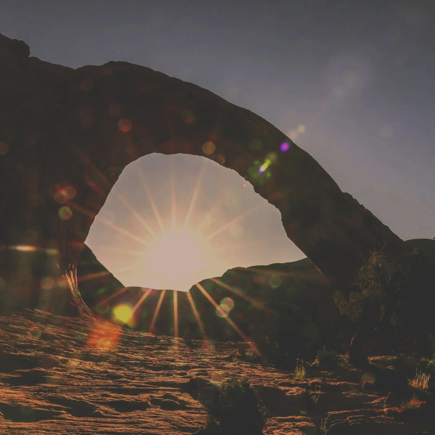 Sun shines through a rock formation in Utah to represent an open blood vessel for Acupuncture for Heart Health