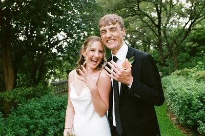 Couple Flashing their rings in a garden at their wedding in Austin Texas