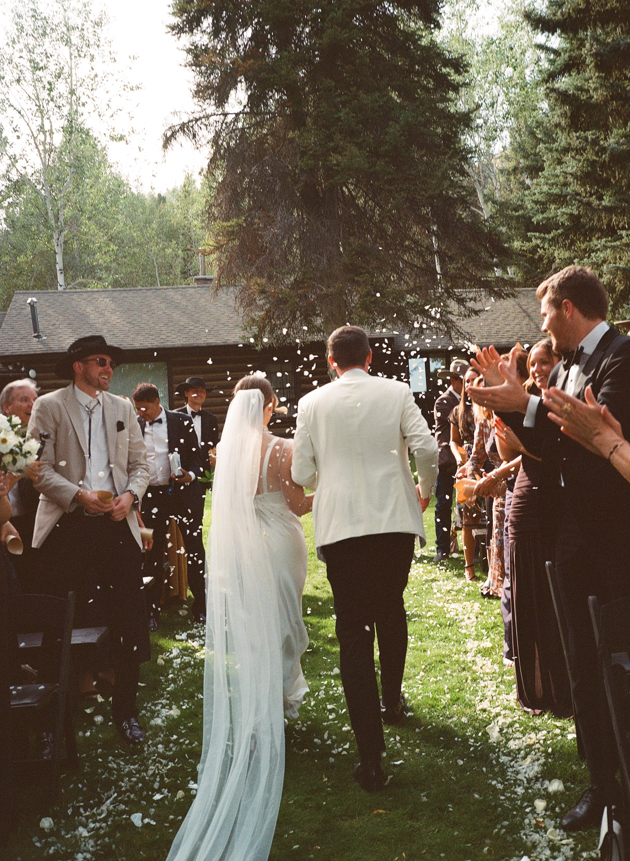 Jackson Hole Wedding Photographer. Film wedding Photography. Elizabeth Fillmore Bridal. Tracey Garcia Makeup Artist. White Tent Wedding. Tom Barnett Tux