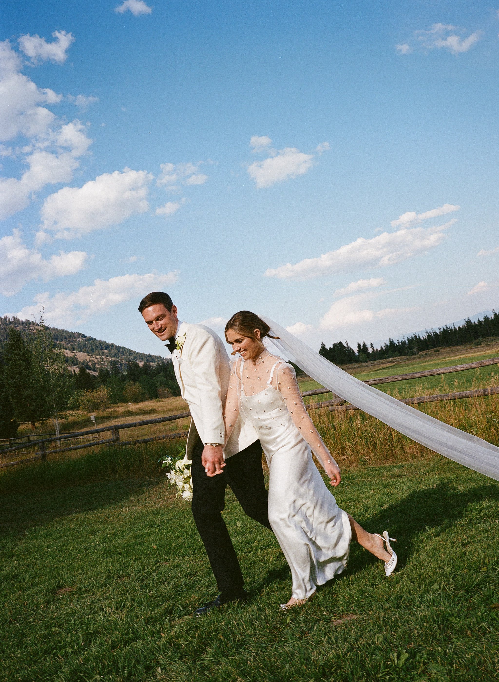 Jackson Hole Wedding Photographer. Film wedding Photography. Elizabeth Fillmore Bridal. Tracey Garcia Makeup Artist. White Tent Wedding. Tom Barnett Tux
