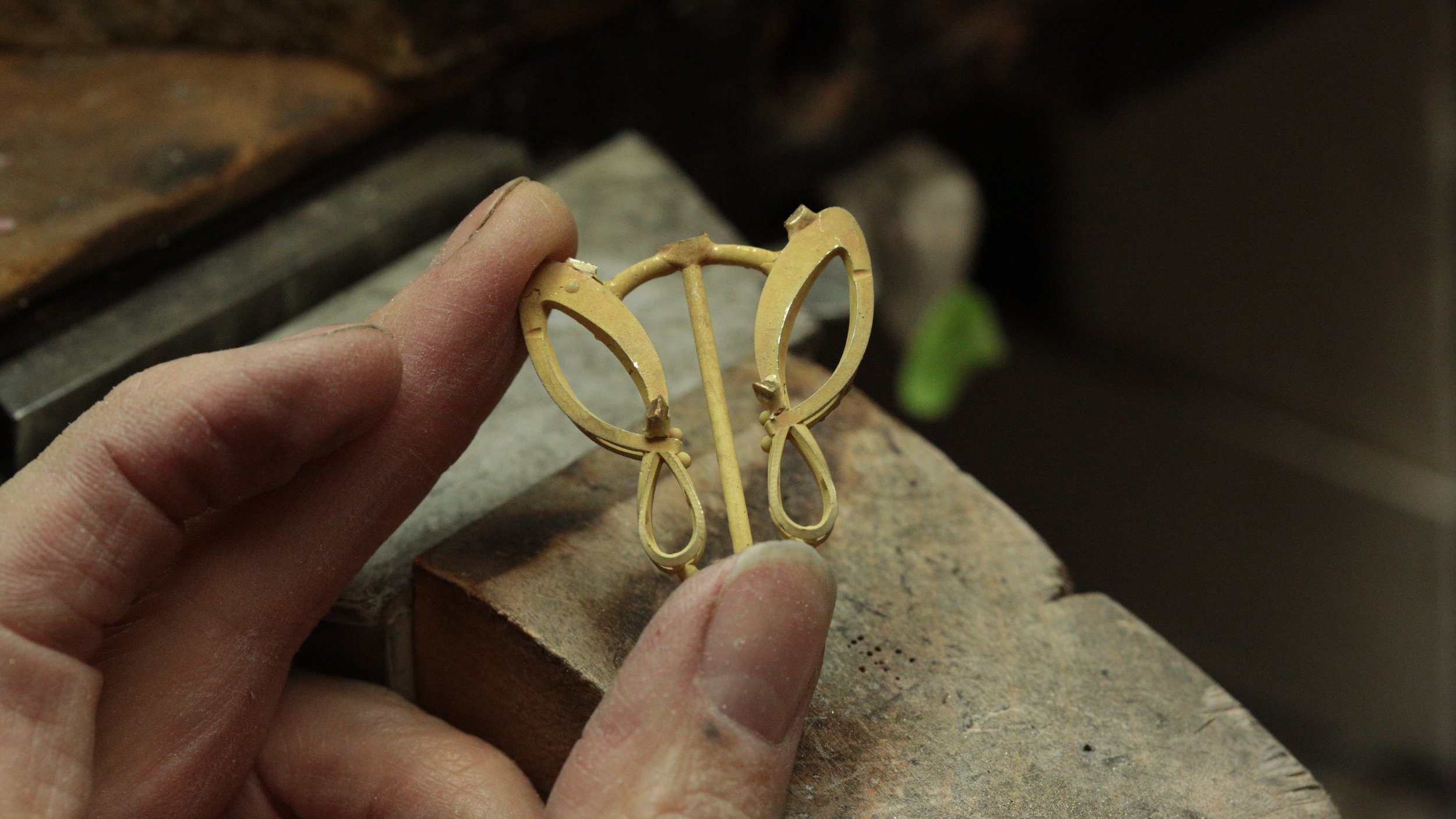 After shaping the individual components, our jeweler assembled the raw gold framework, which you can see in its early stages crafted in our studio in Arden Arcade.