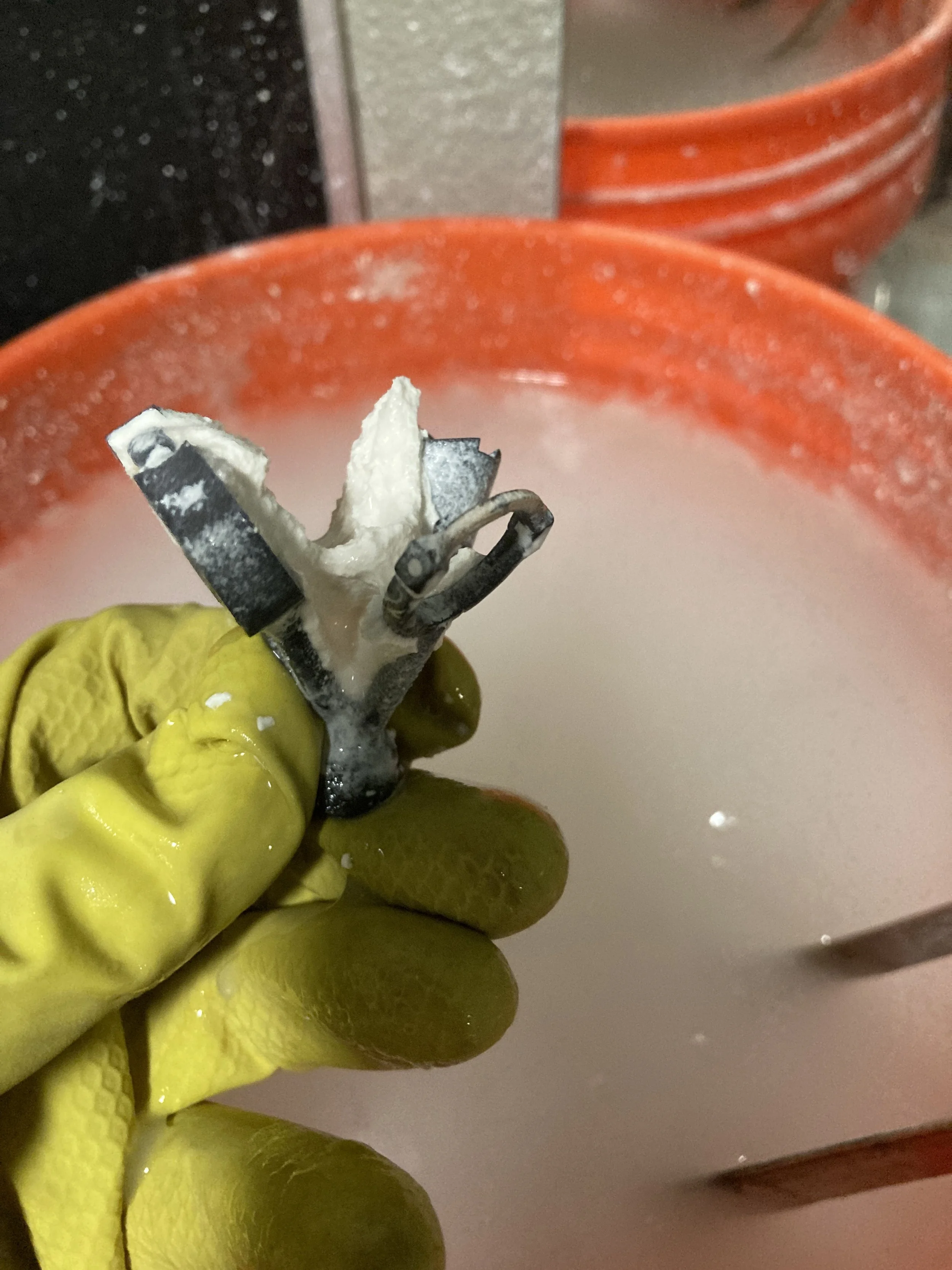 the raw ring casting fresh from the quench, still coated in the white investment plaster
