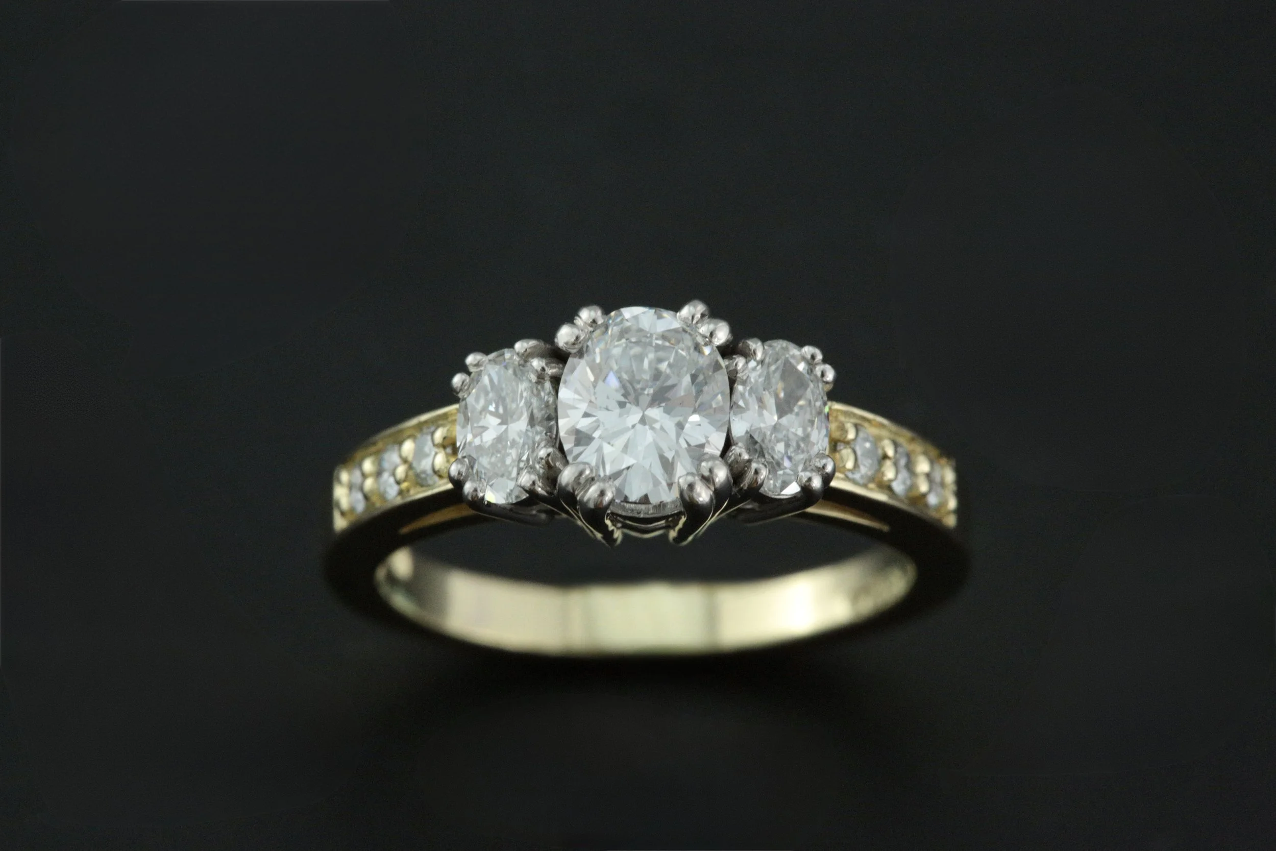 Lisabell Diamond Ring. 18K yellow & white gold ring with Diamonds -  Center 0.65 carats, VS1/E, Side 0.37 carats, VS1/E and Melee 0.09 carats. Designed and handcrafted by Larry Stark