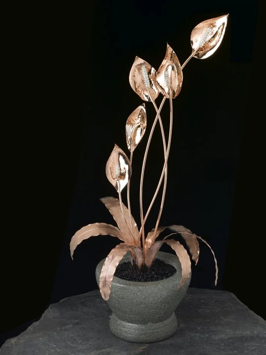 Transform your space with the exquisite hand-sculpted Peace Lily Masterpiece, featuring detachable brooches for a touch of elegance in any setting.