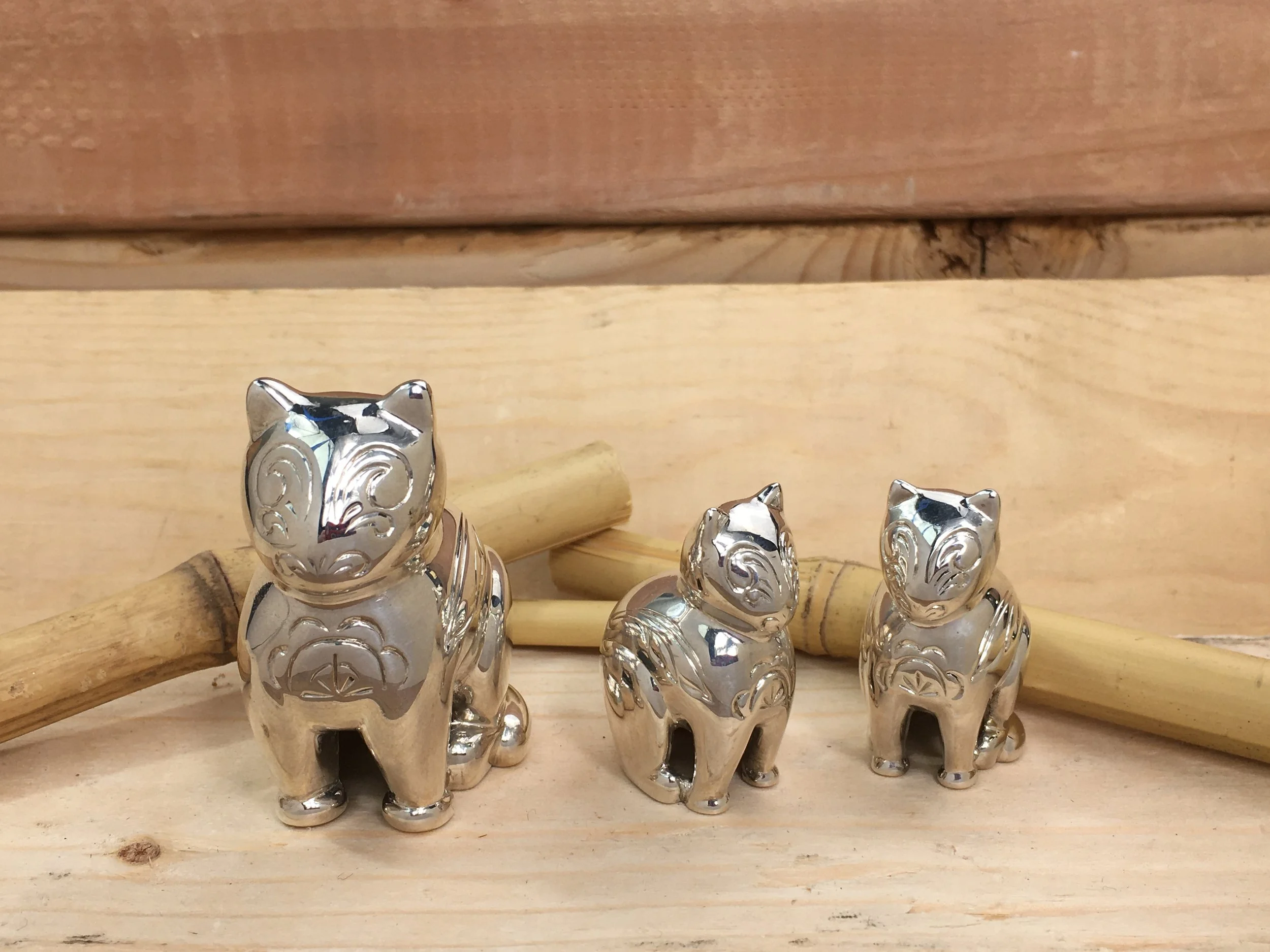 Sterling Silver Cat Family Sculptures
1 Large cat: 2.5in by 2in
2 Small cats: 1.75in by 1.5in

Introducing an exquisite and enchanting set of three captivating sculptures, each meticulously crafted from luxurious sterling silver, depicting the gracef