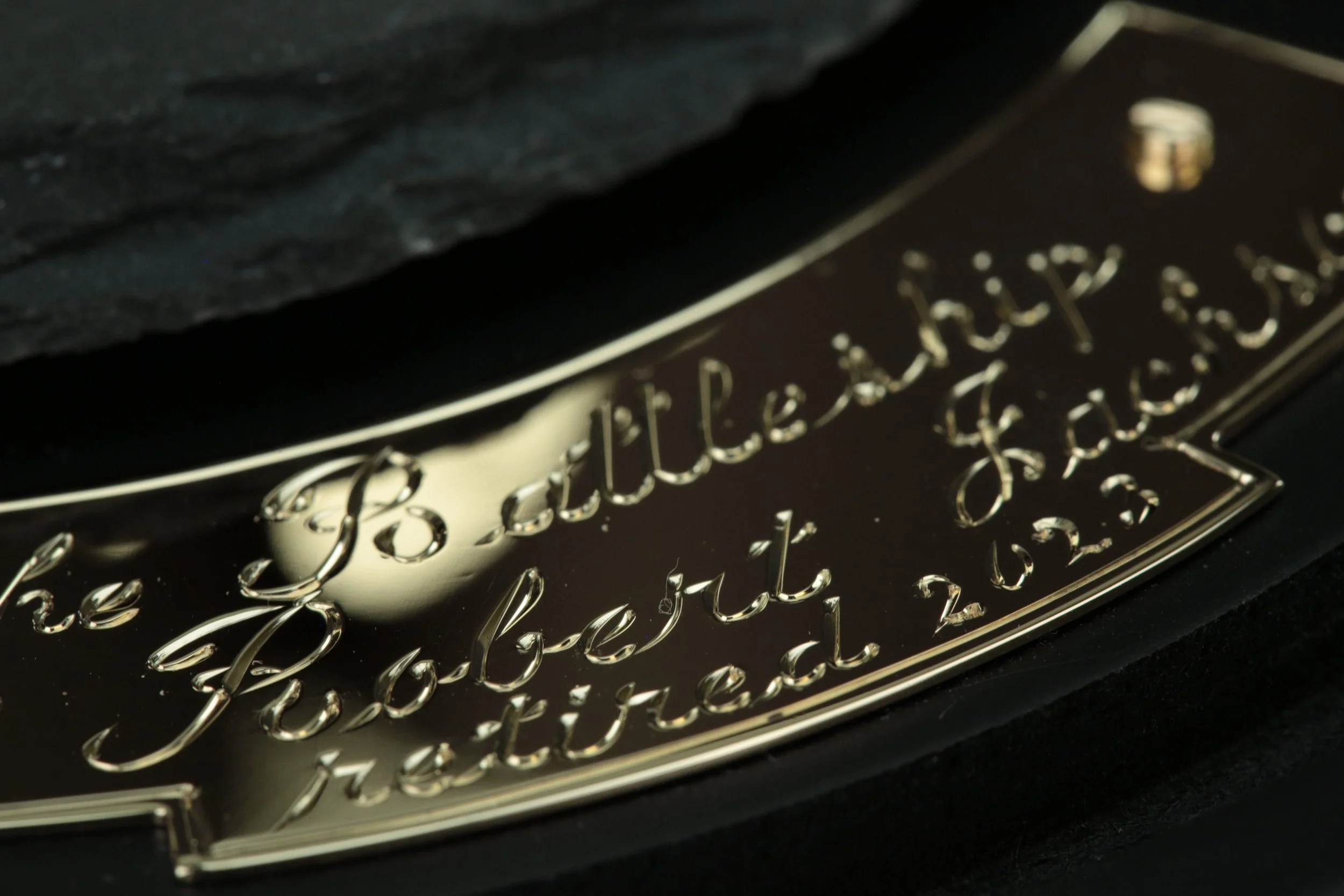 Master gold smith Larry Stark engraving for a piece of custom jewelry in his studio in Sacramento