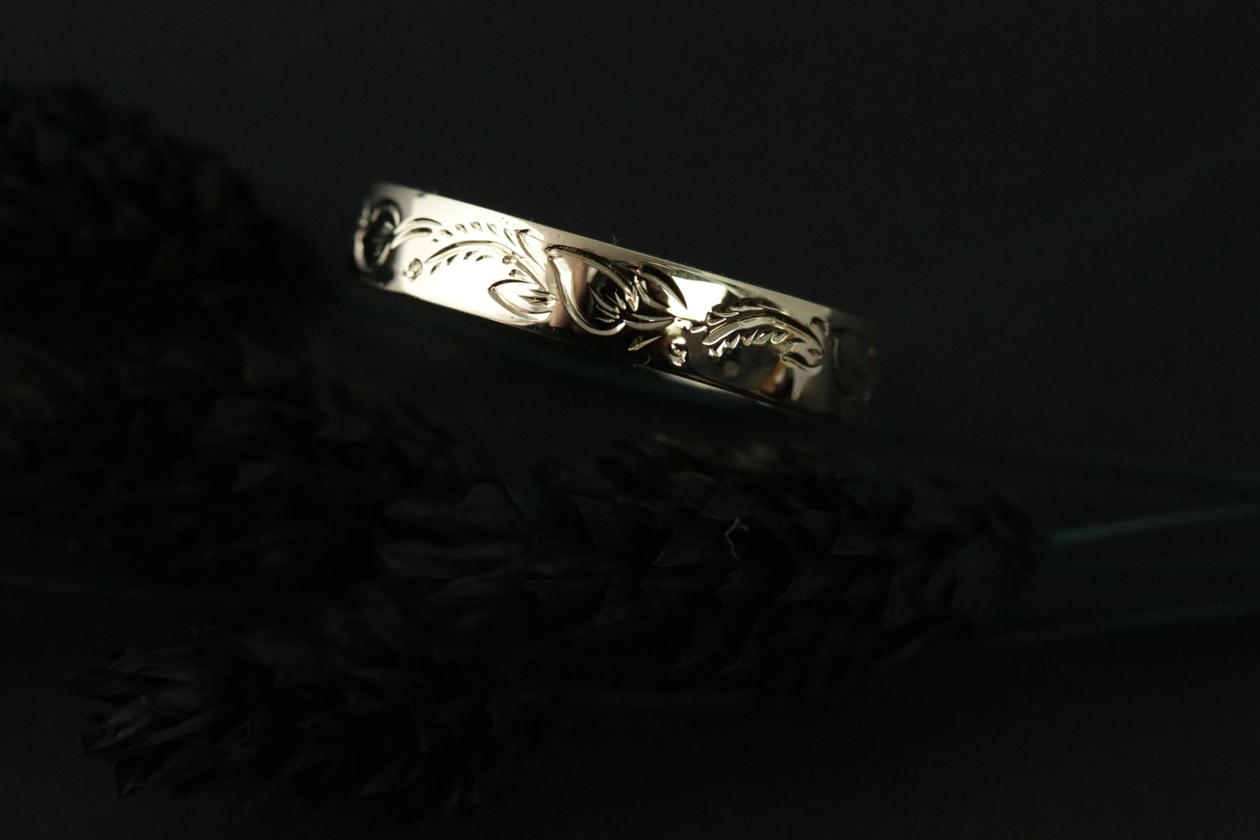 Larry created a custom hand-engraved design for the groom, when worn, the deep-relief engraving catches the light dynamically, offering a rugged yet sophisticated contrast.